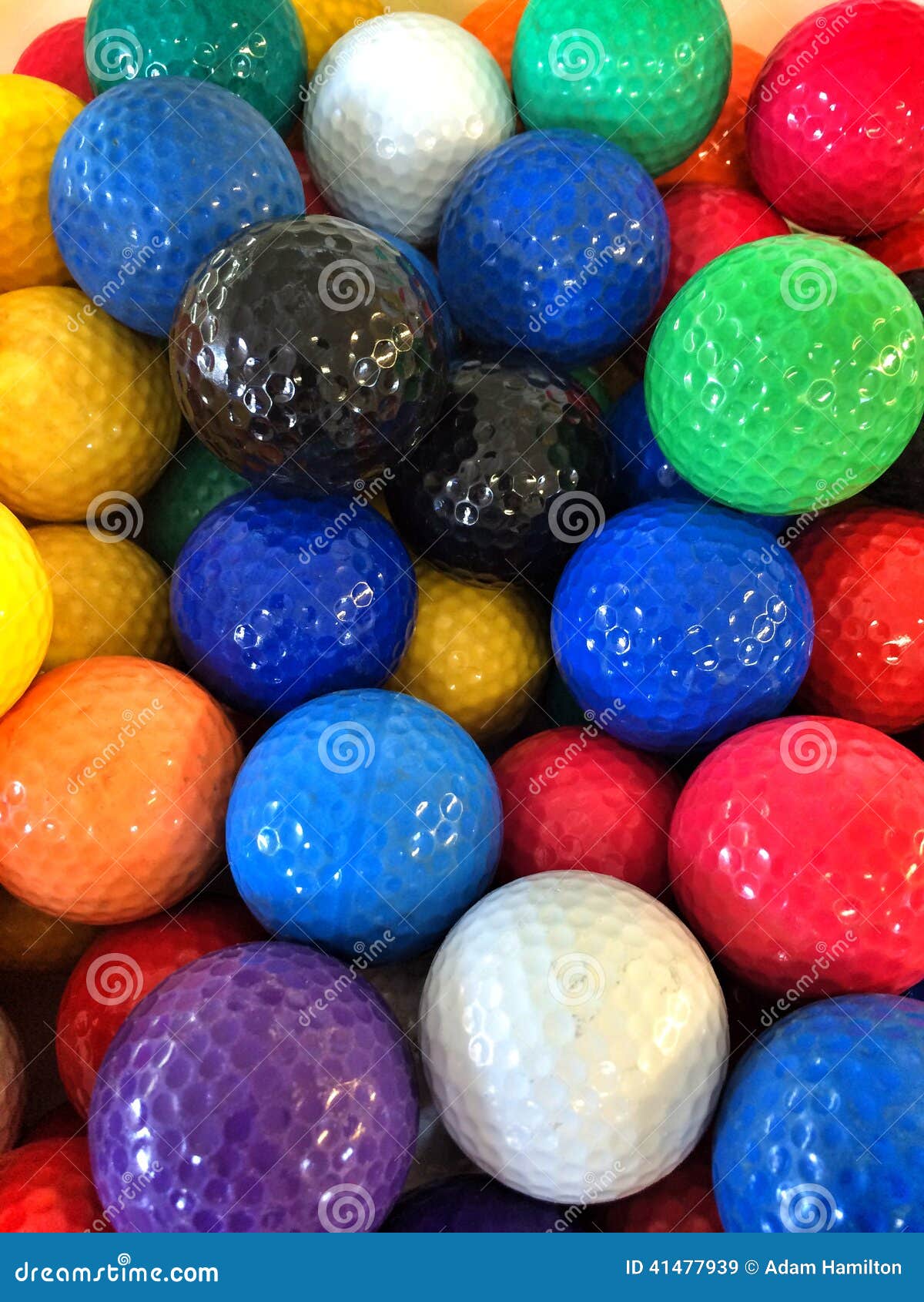 a bunch of colorful mini-golf golf balls