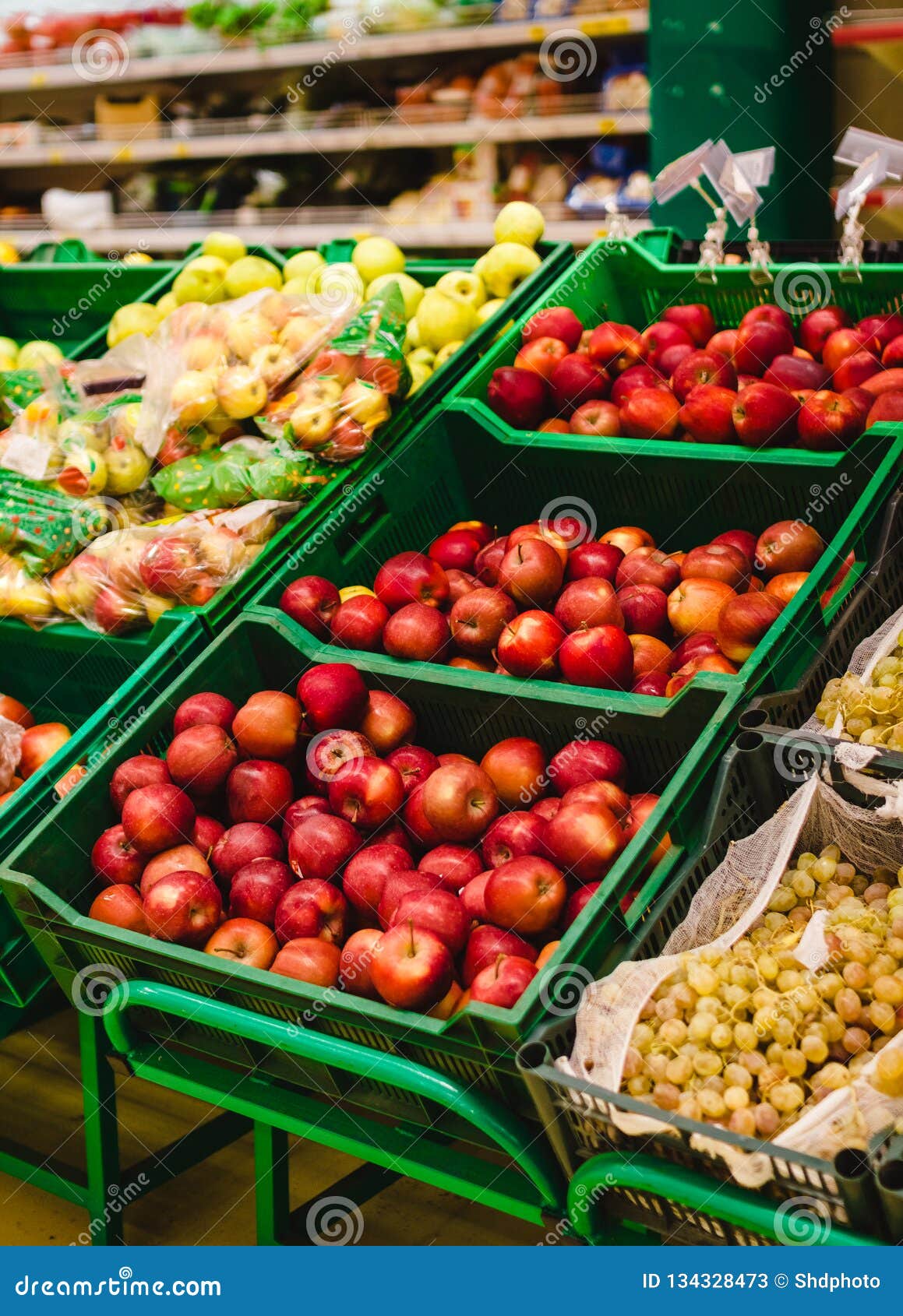 Bunch of Red and Green Apples on Boxes in Supermarket Stock Image