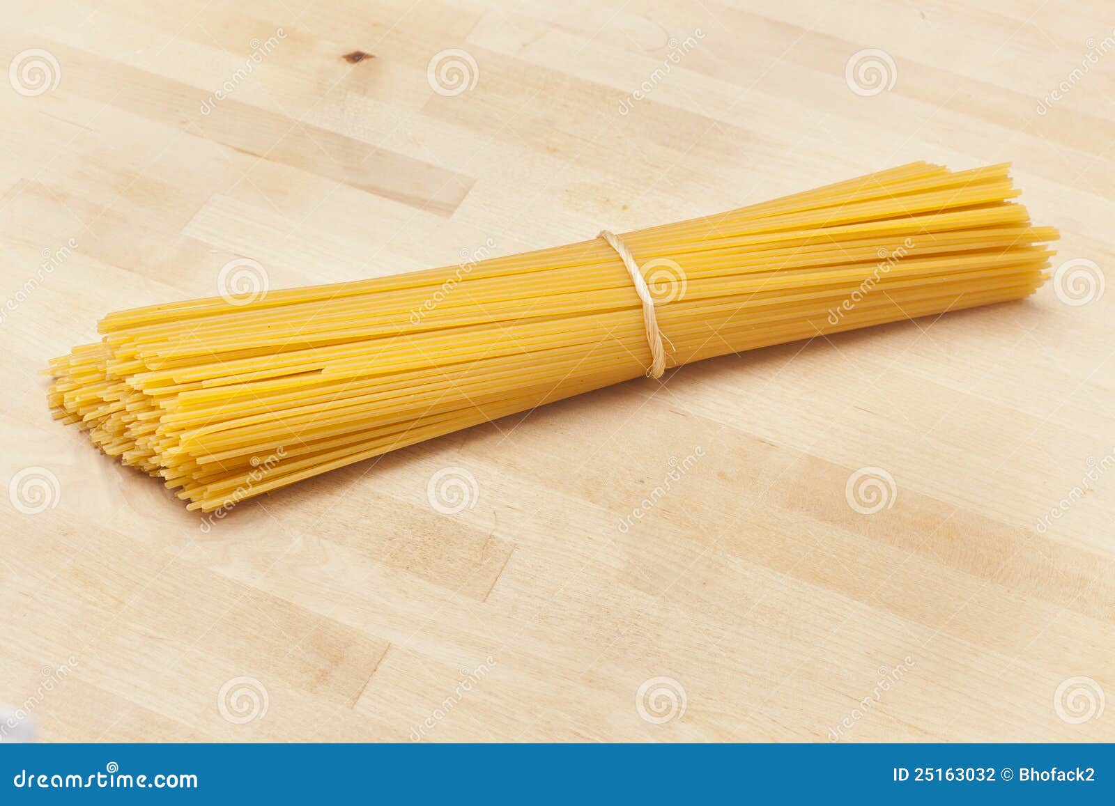 Bundle of dry spaghetti stock photo. Image of yellow 25163032