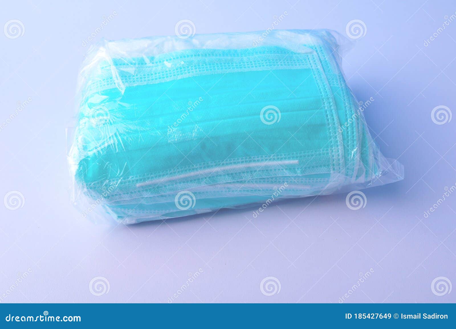 Bundle of Surgical Face Mask in Plastic on White Table Stock Image