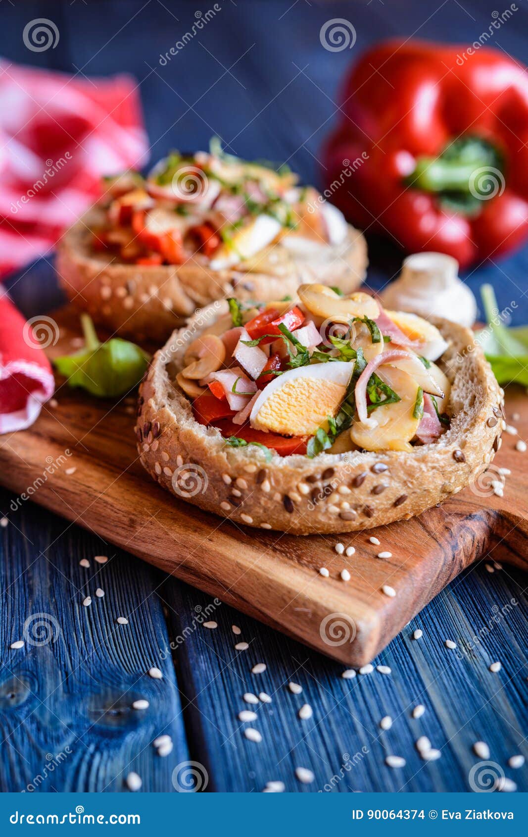 Buns Stuffed with Mushrooms, Bell Pepper, Eggs and Bacon Stock Photo