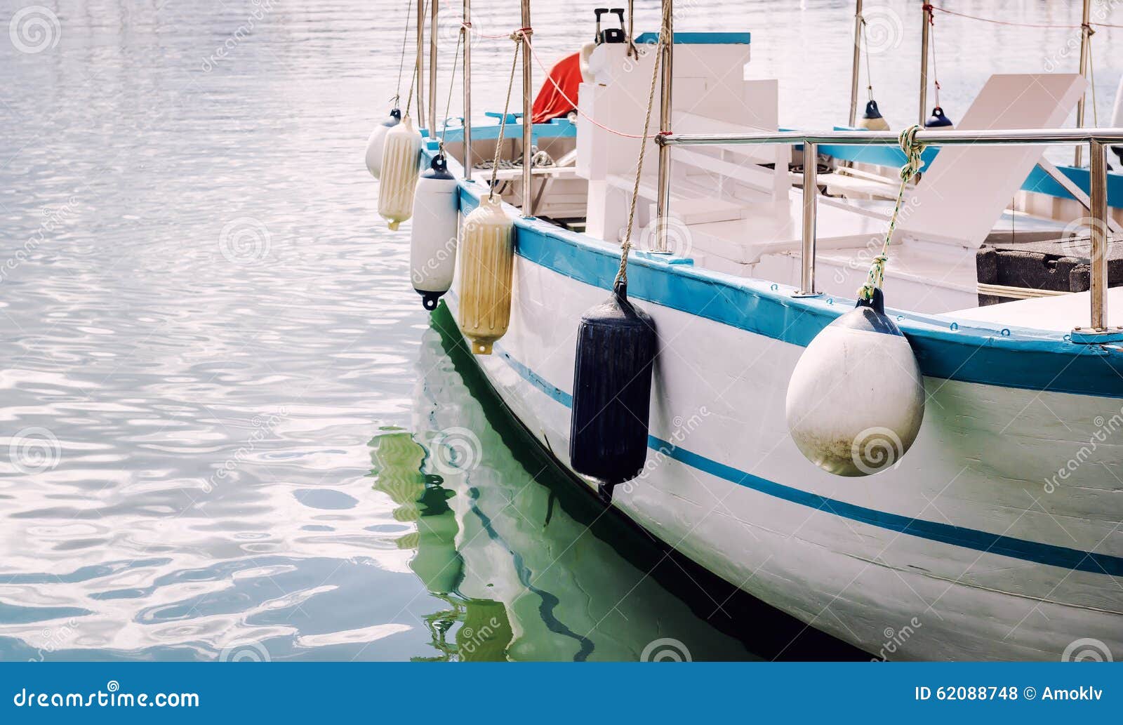 Buoys on a moored boat stock photo. Image of motorboat 62088748