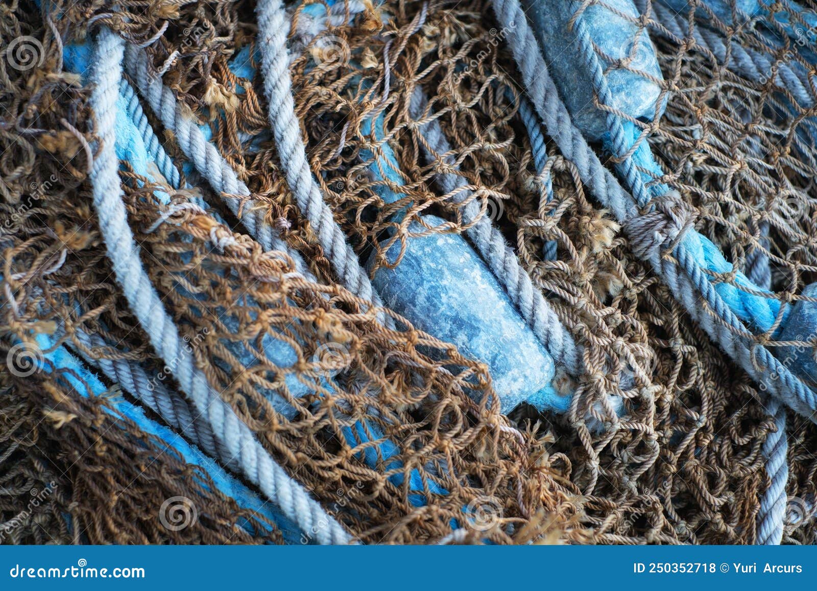 Buoys and a Net Tangible Together As Fishing Gear or Equipment at a Harbor.  Closeup of Blue Sea Markers and Mesh Piled Stock Photo - Image of tangible,  harbor: 250352718