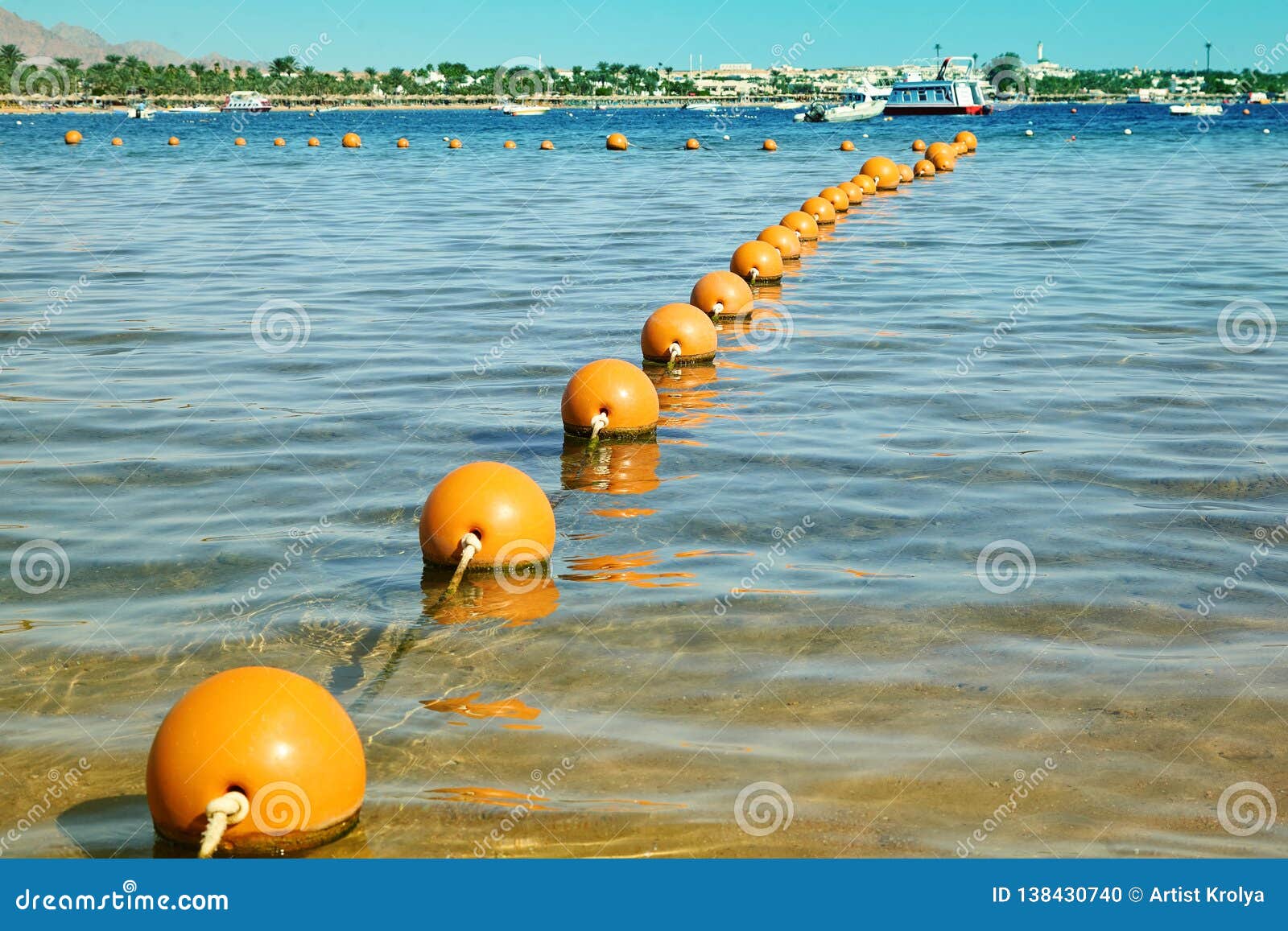 View of the Sea from a Shore with a Long Line of Orange Colored