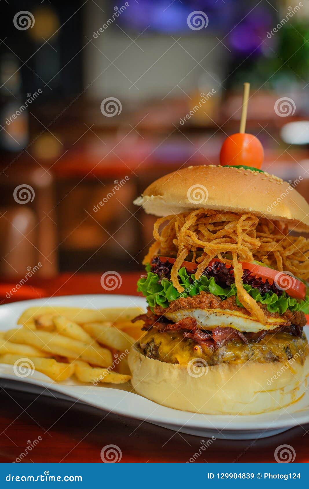 A Burger with Beef Patty and Bacon and Cheddar Cheese and Egg, Chilli