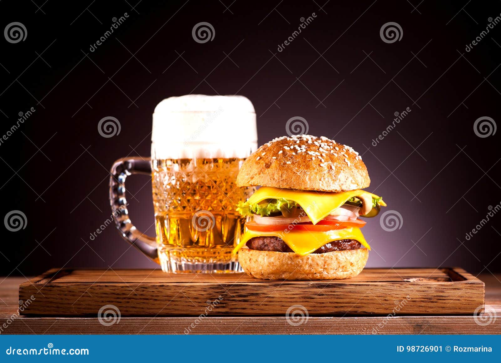 Cheeseburger and beer stock image. Image of burger, eating 98726901