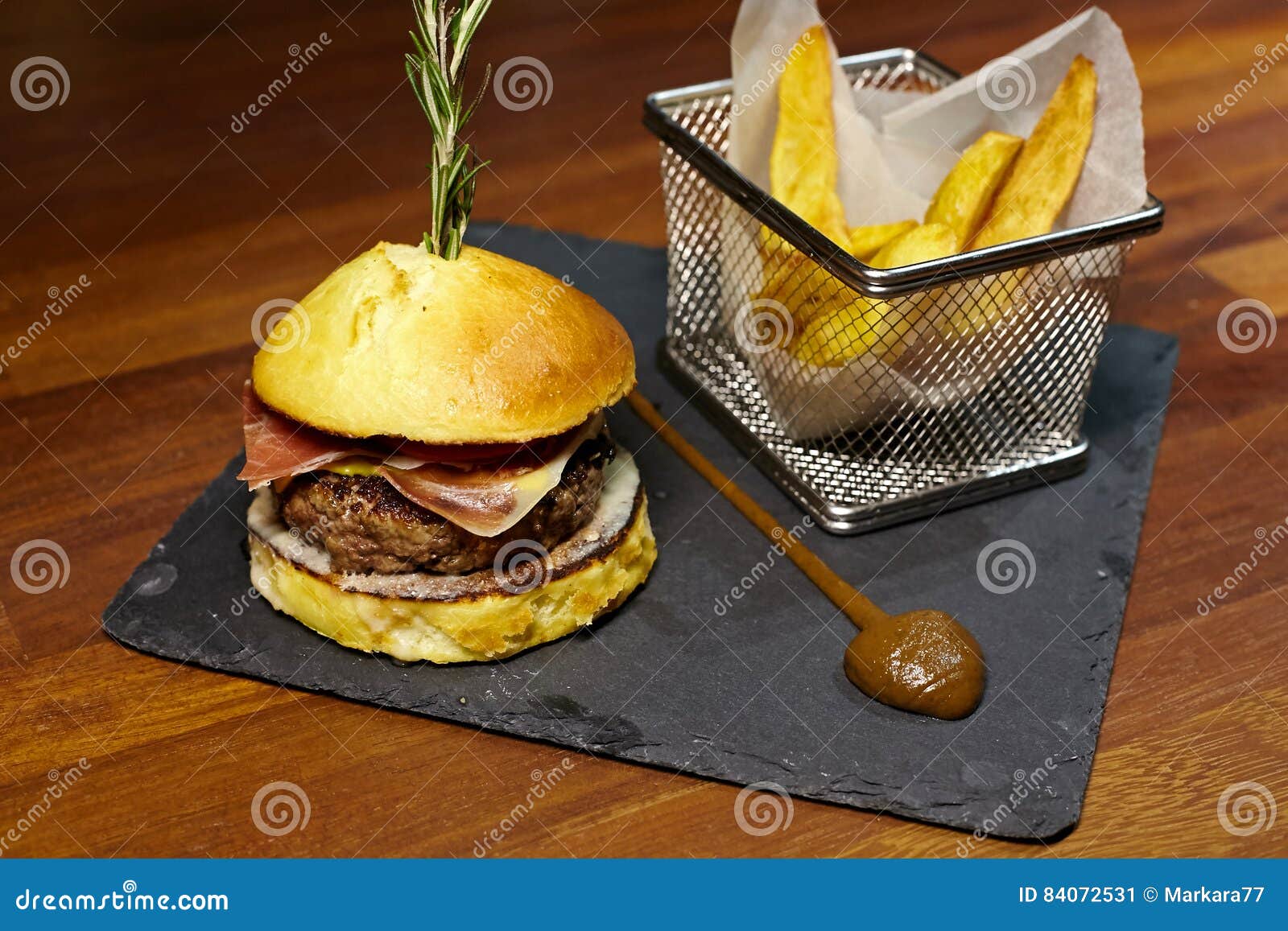 Burger with Veal Meat, Blue Cheese, Bacon, Tomato and Cheddar. Stock
