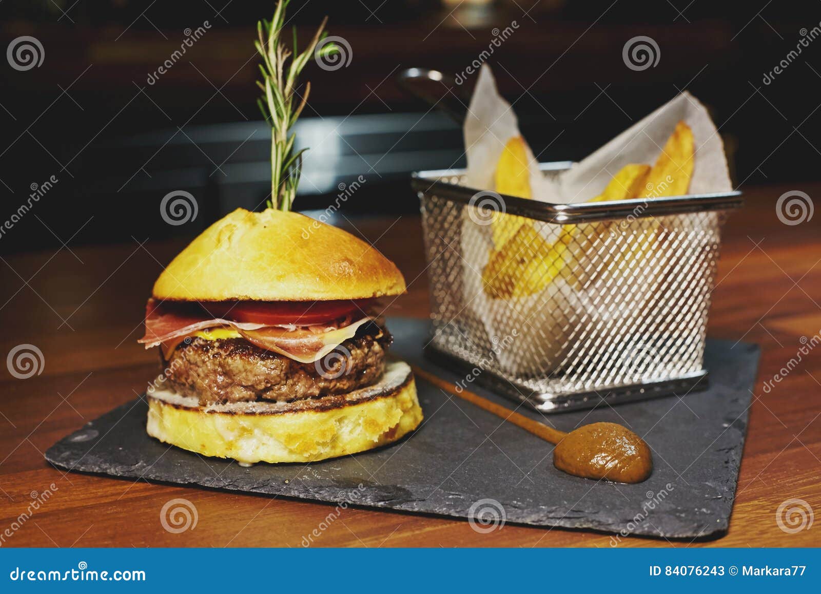 Burger with Veal Meat, Blue Cheese, Bacon, Tomato and Cheddar. Stock