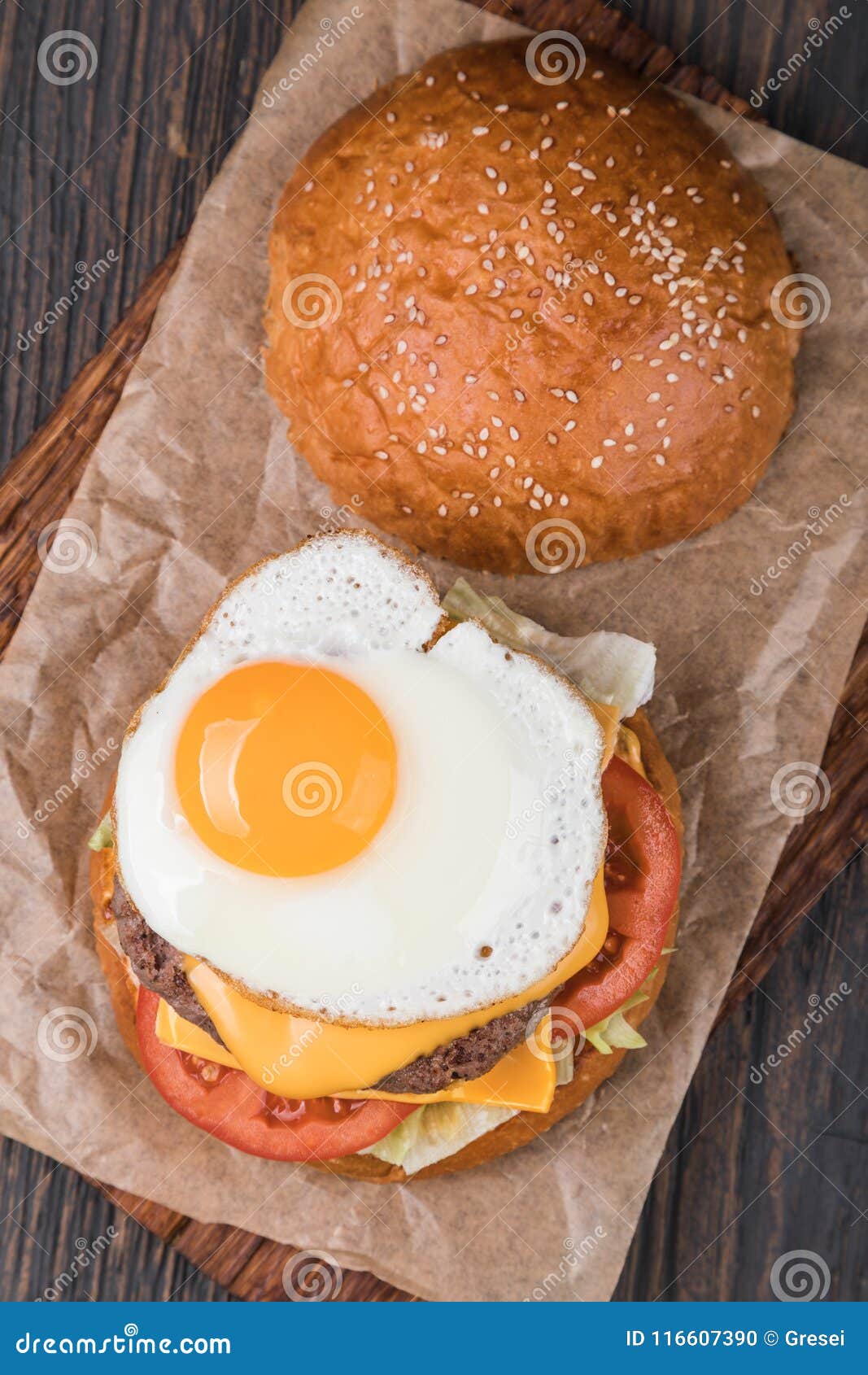 Burger on a wooden board stock photo. Image of onion - 116607390