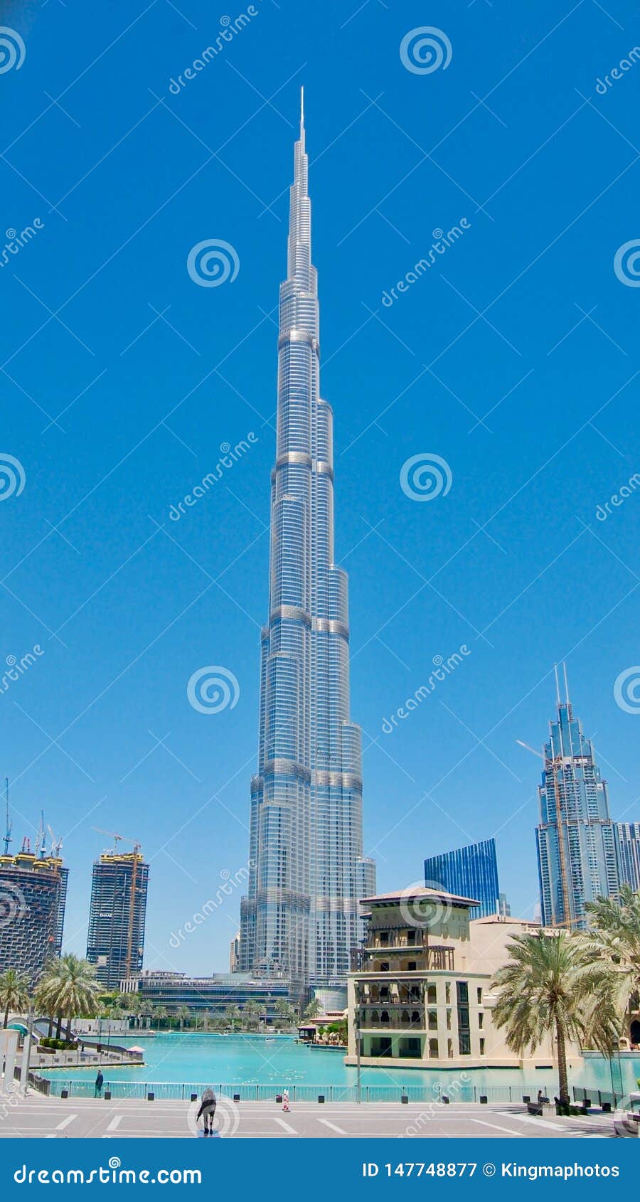 Burj Khalifa World`s Tallest Tower Against a Deep Blue Sky Background in  Dubai, United Arab Emirates with Reflective Pond in Front Editorial  Photography - Image of architecture, city: 147748877