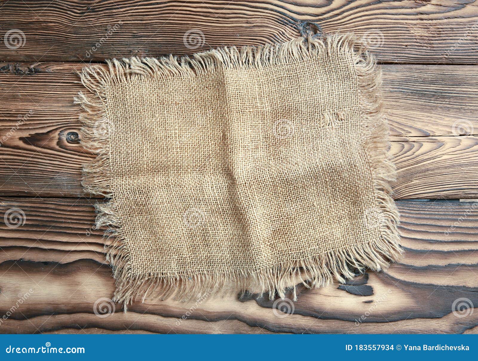 burlap cloth on dark wooden background,tabletop top view,food advertiement backdrop