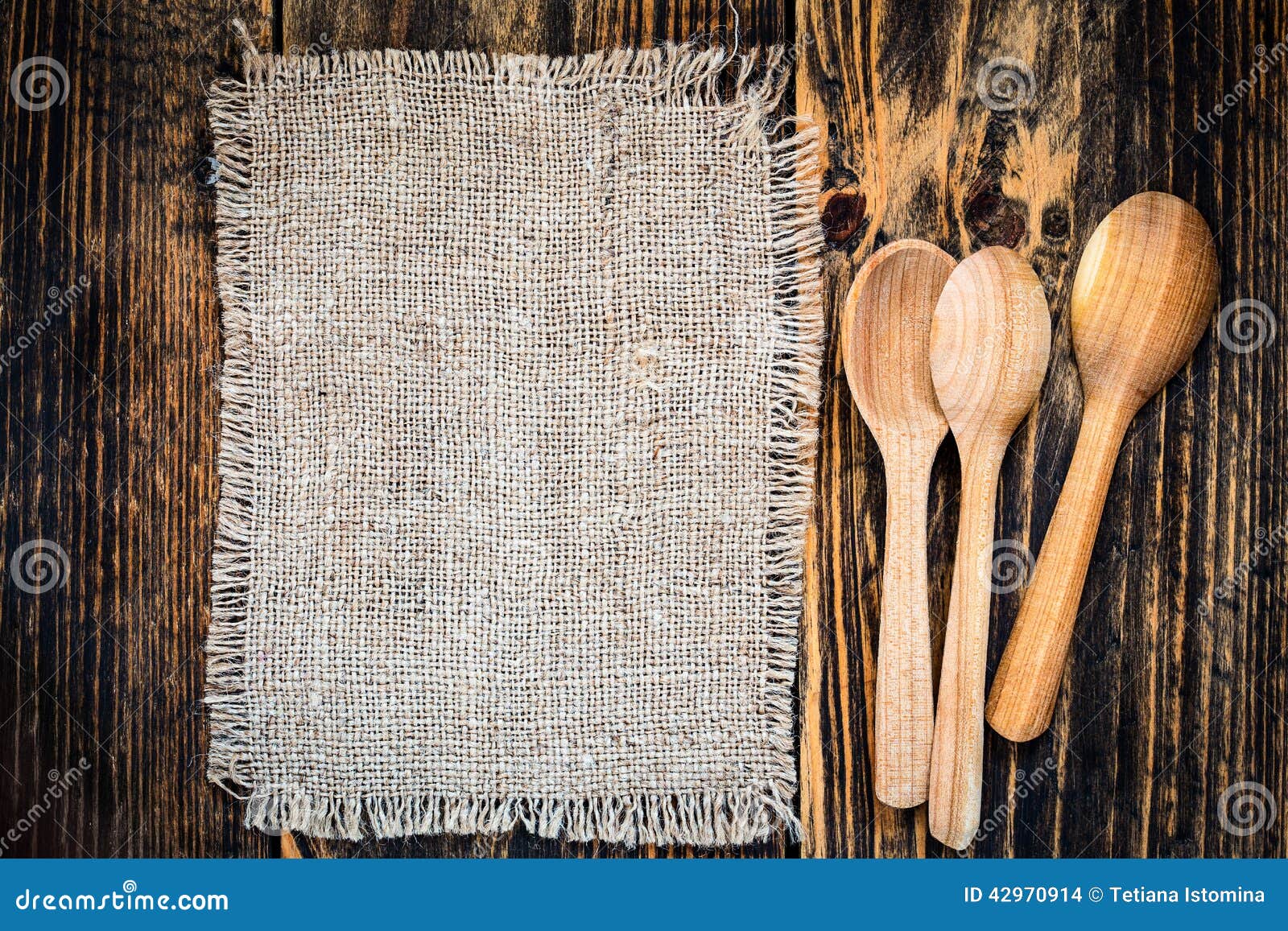 burlap and rural kitchen utensils on wooden table view