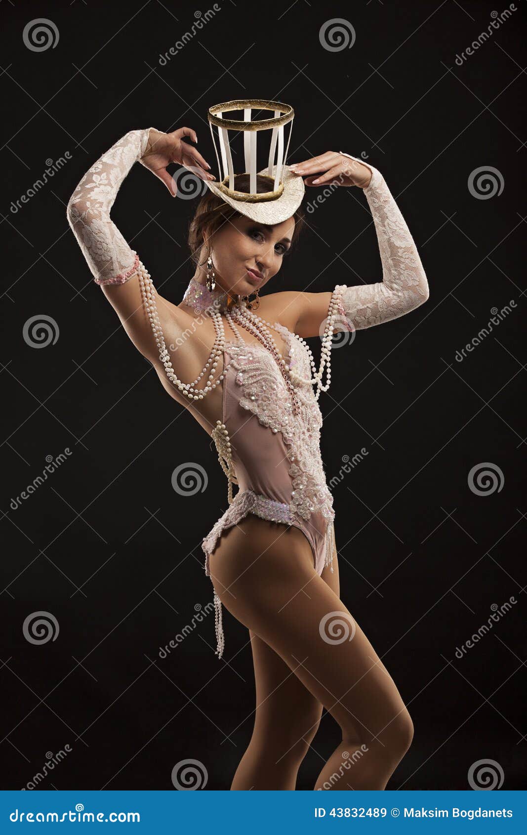 burlesque dancer in white dress with hat