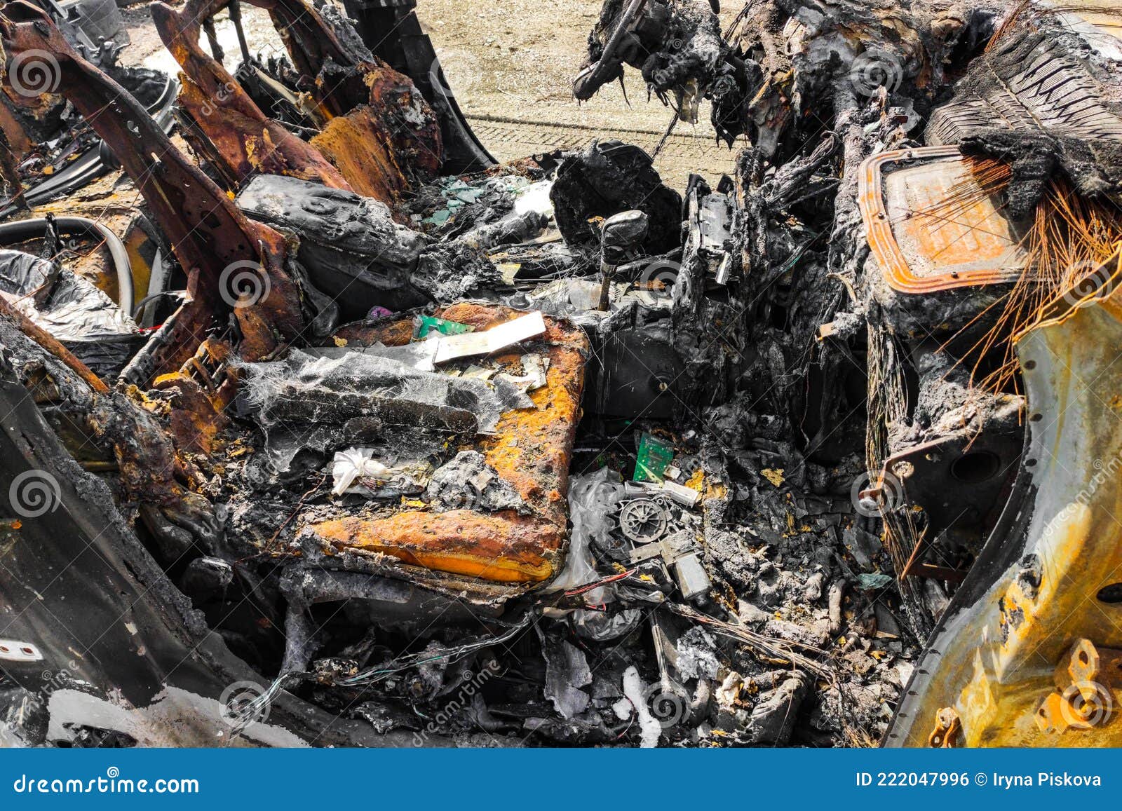 Burnedout Car after Arson Accident. Melted Plastic in a Fire. Stock