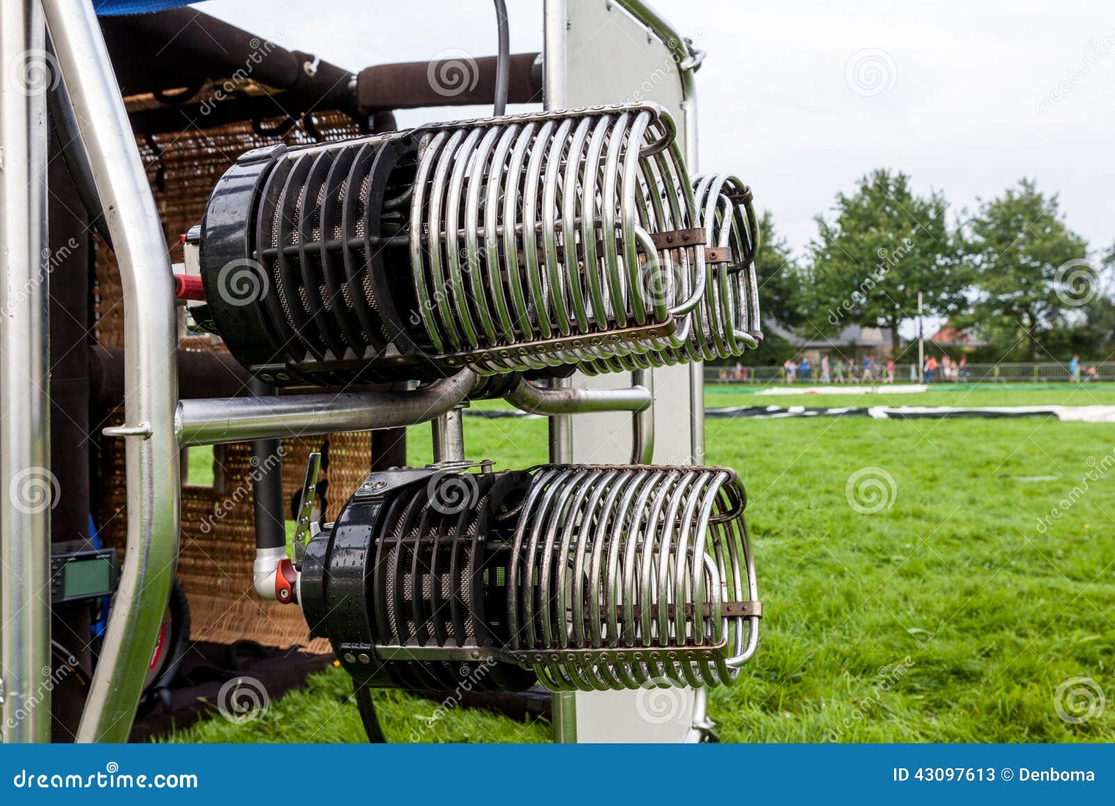 Burner air balloon with basket lying down in field