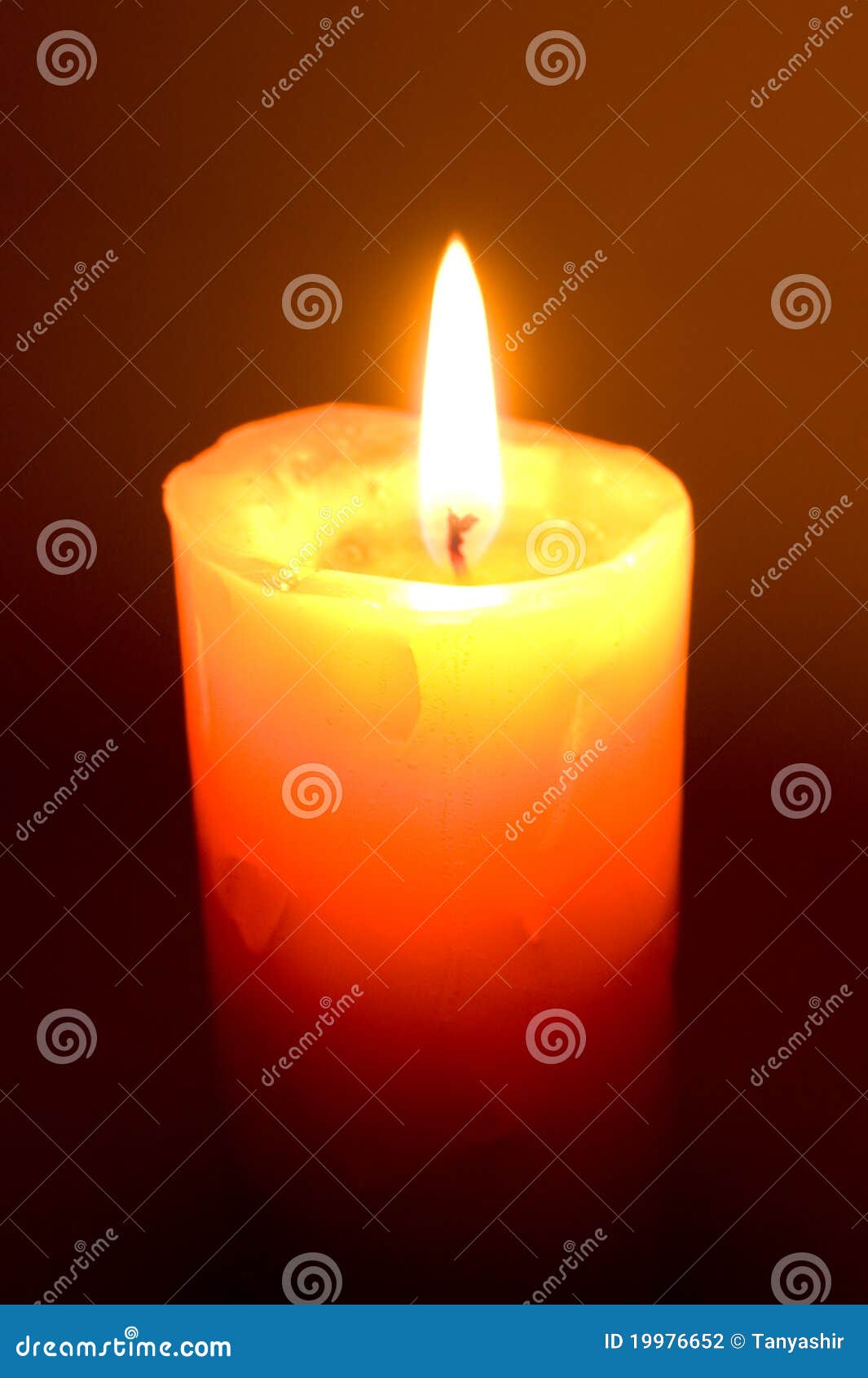 Burning Candle On A Black Background. Flame Of Fire RoyaltyFree Stock