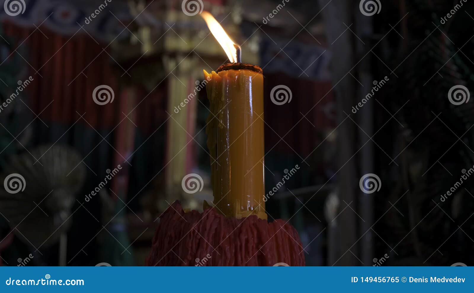 Burning Candle on a Black Background in the Temple. Stock Image Image