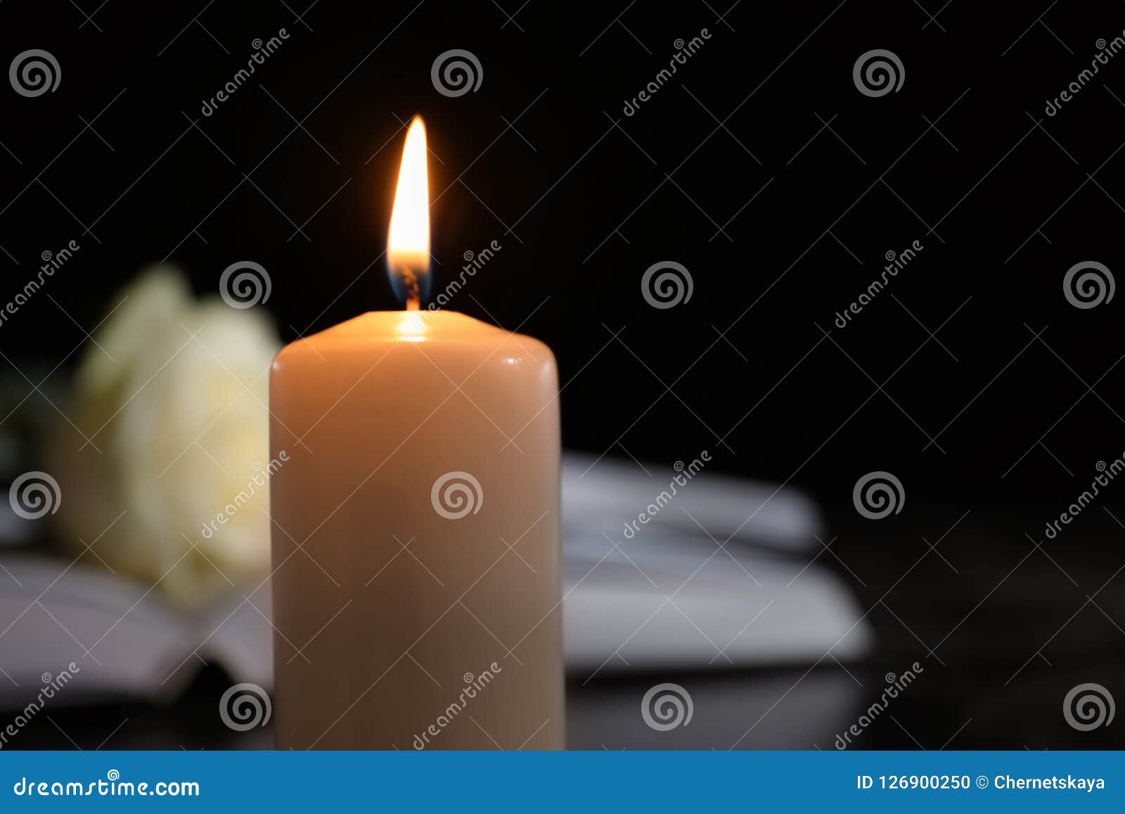 Burning Candle On Blurred Background, Space For Text. Stock Photo