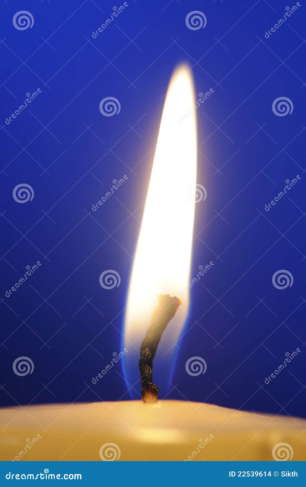 Burning Candle Flame CloseUp on Blue Background Stock Photo Image of