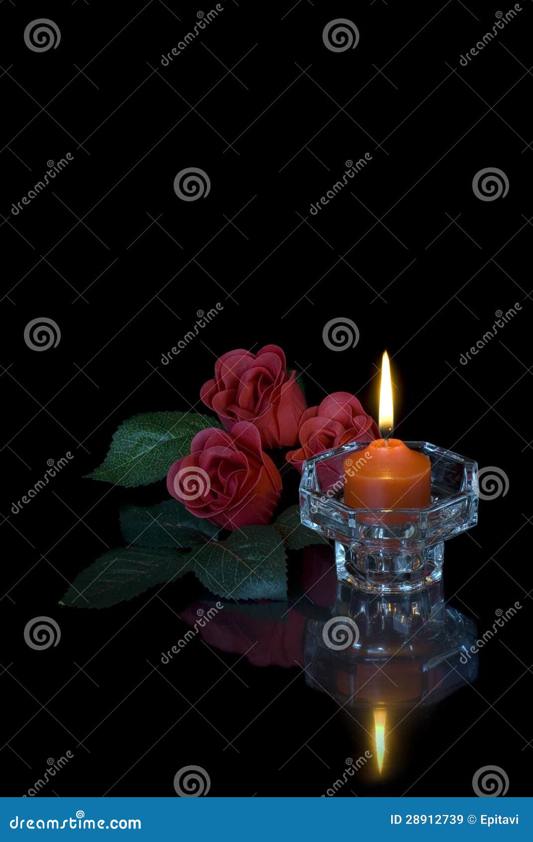 Burning Candle and Three Red Roses on a Black Background Stock Image