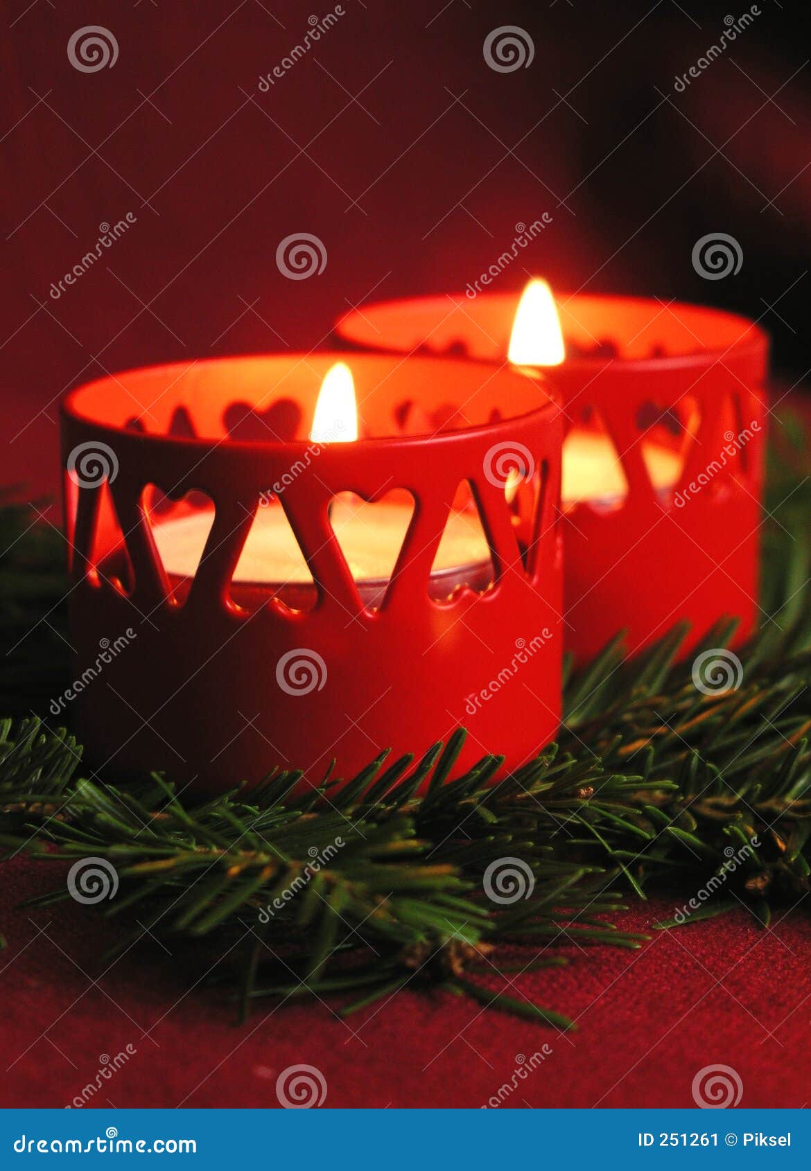 Burning Candles In The Temple On The Background Of A Golden Cross