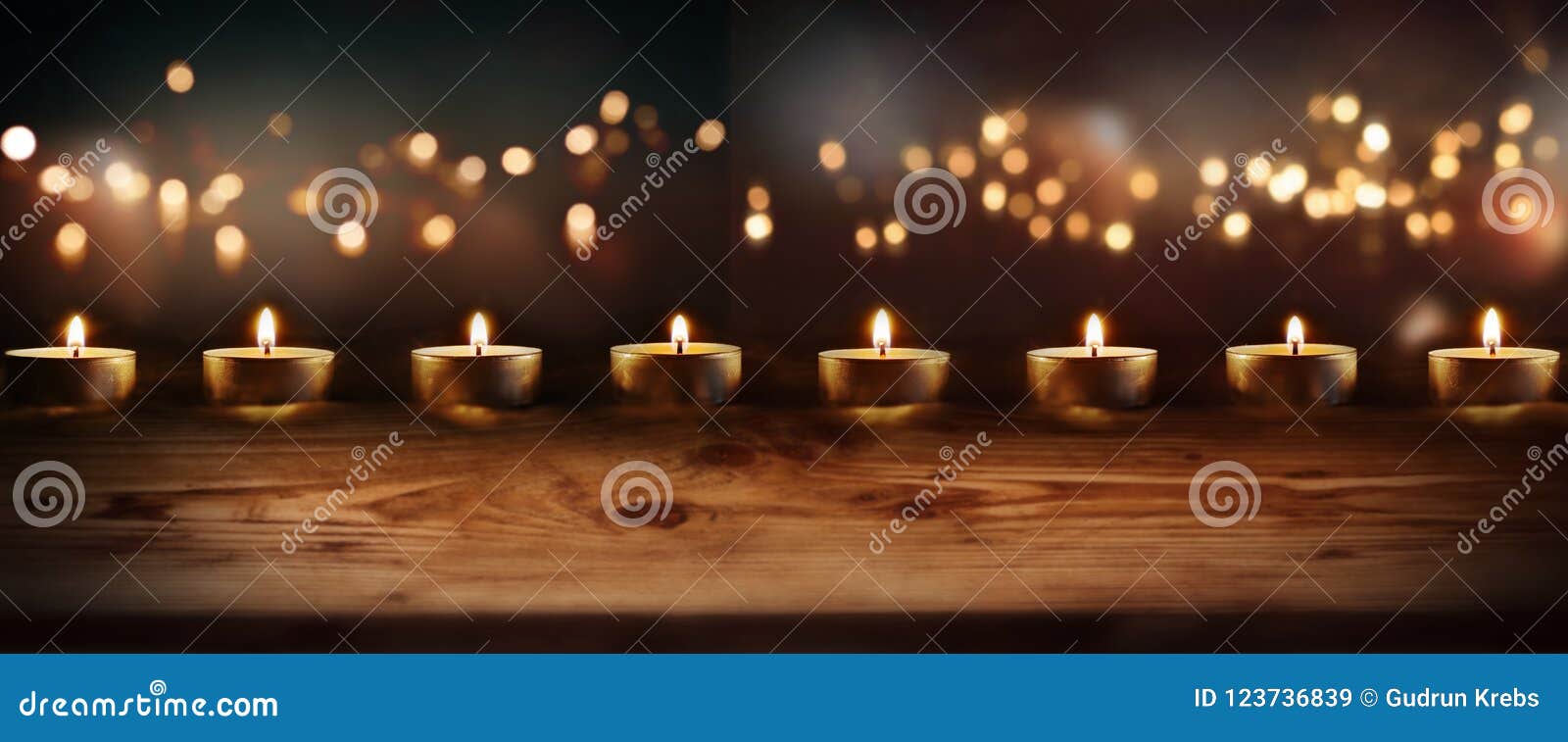 burning candles with celebratory bokeh