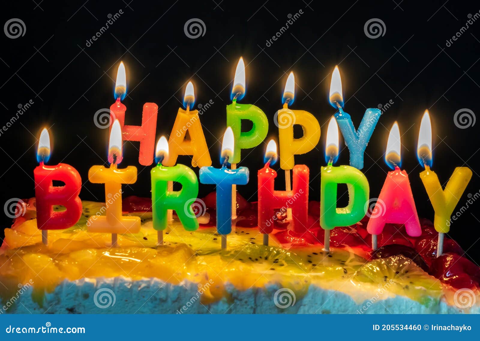 Burning Candles in the Form of Letters Happy Birthday Stock Photo