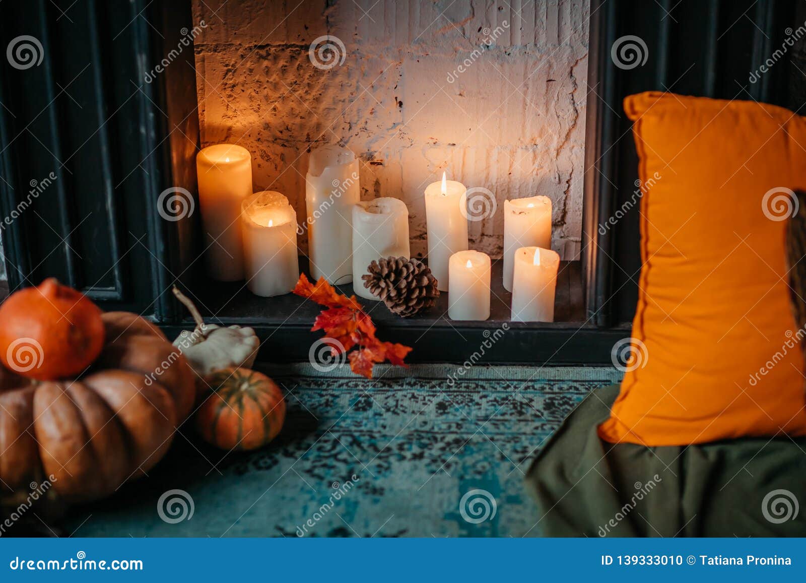 Burning Candles, Lit in the Fireplace. Room Decoration. Stock Photo