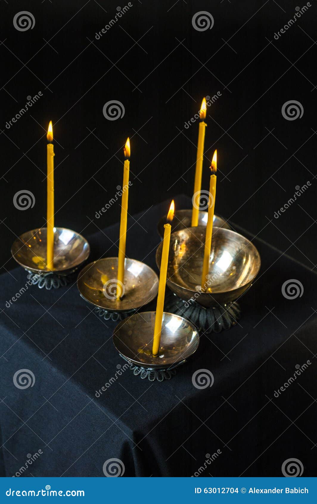 Burning candles. Photo of burned church candles on black background.