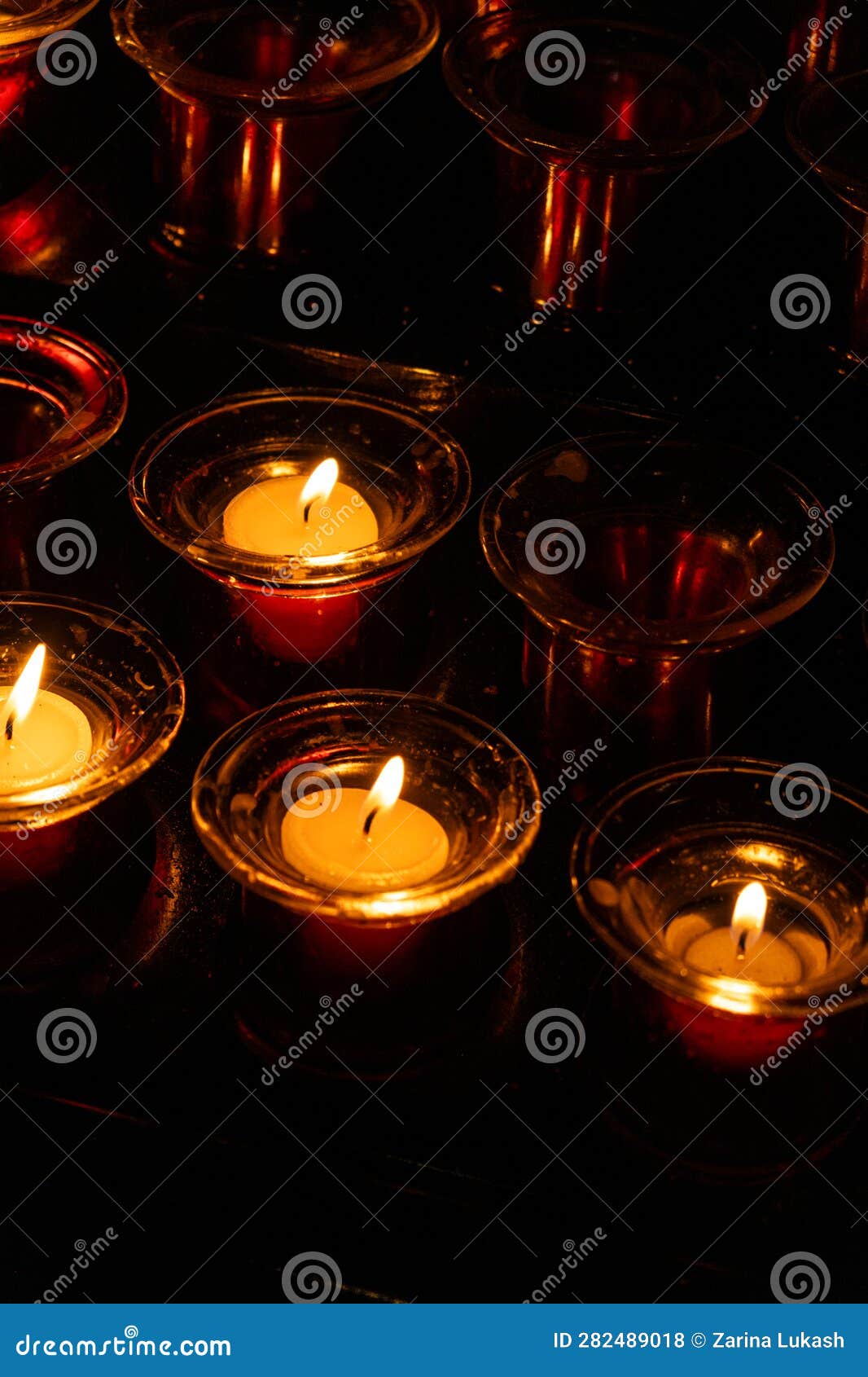 Burning Candles in Red Candlesticks in the Dark Stock Photo Image of