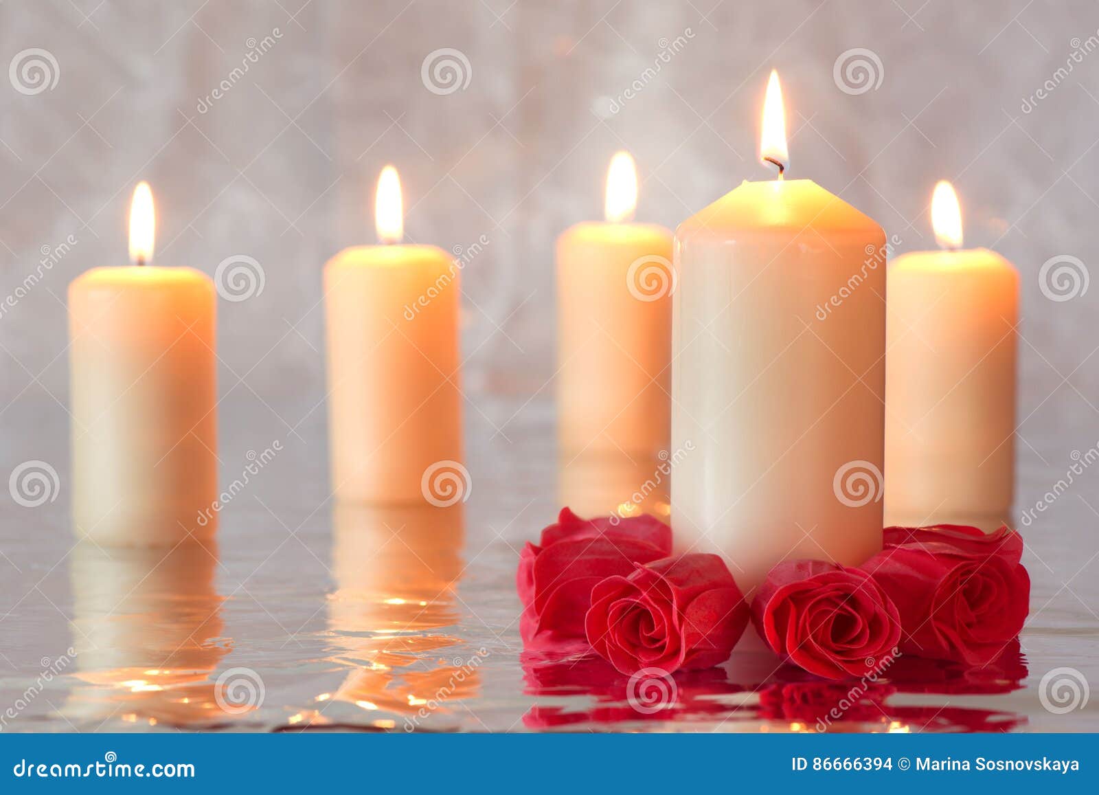 Burning Candles with Red Roses in the Foreground Stock Photo Image of