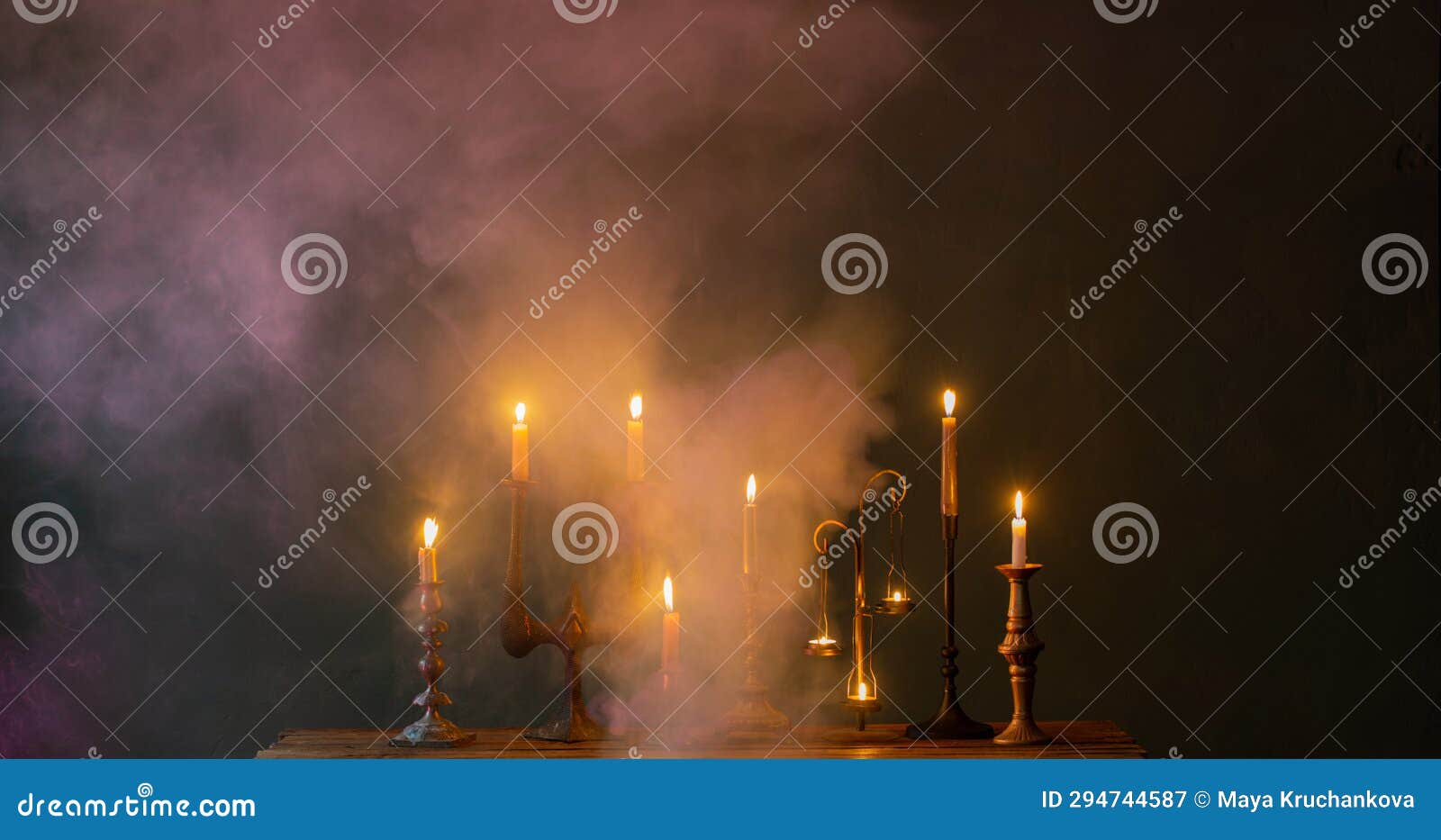 Burning Candles in Vintage Candlesticks on Dark Background Stock Image