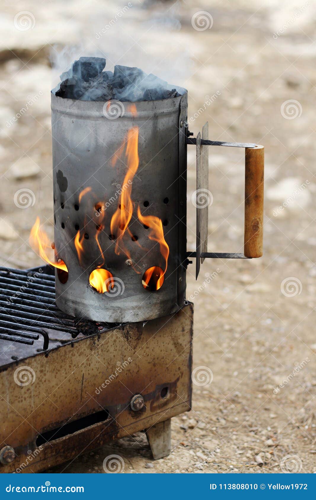 Bbq Chimney Charcoal Fire Starter Full Of Burning Briquettes Being
