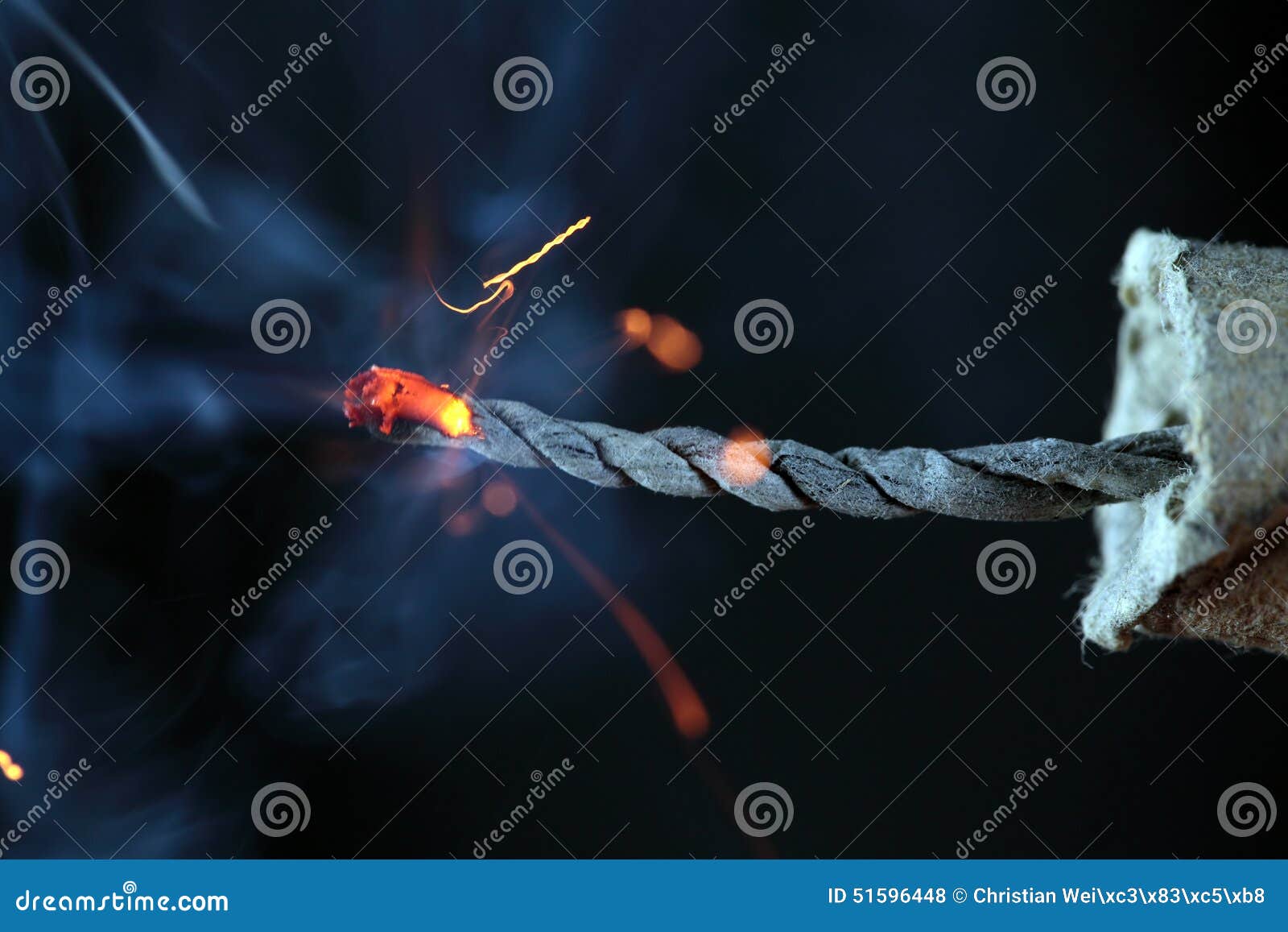 Burning Green Fuse Wick Cord With Sparks And Smoke On Blue Background Stock  Photo, Picture and Royalty Free Image. Image 140358329.