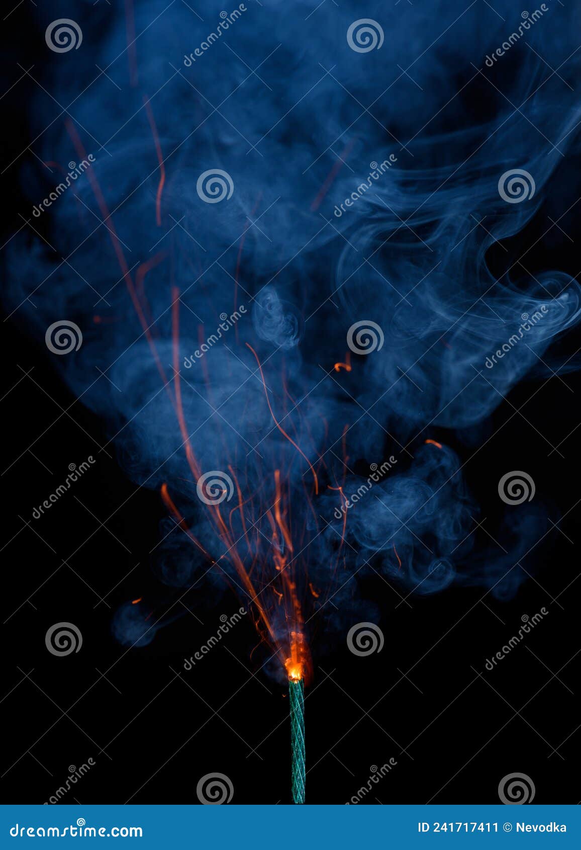 Burning fuse. Dynamite firecracker green fuse burn with sparkles and smoke  on black background. Stock Photo