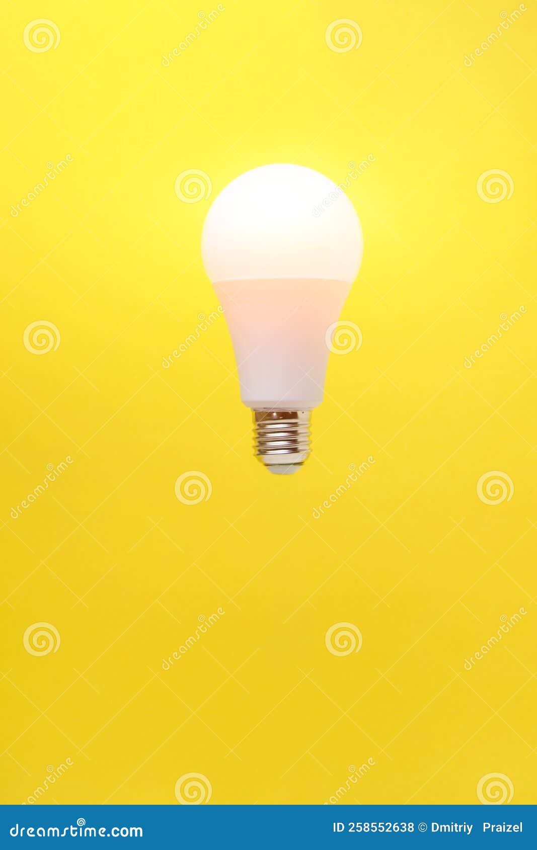 Burning LED Eco Friendly Light Bulb on Yellow Background Stock Photo
