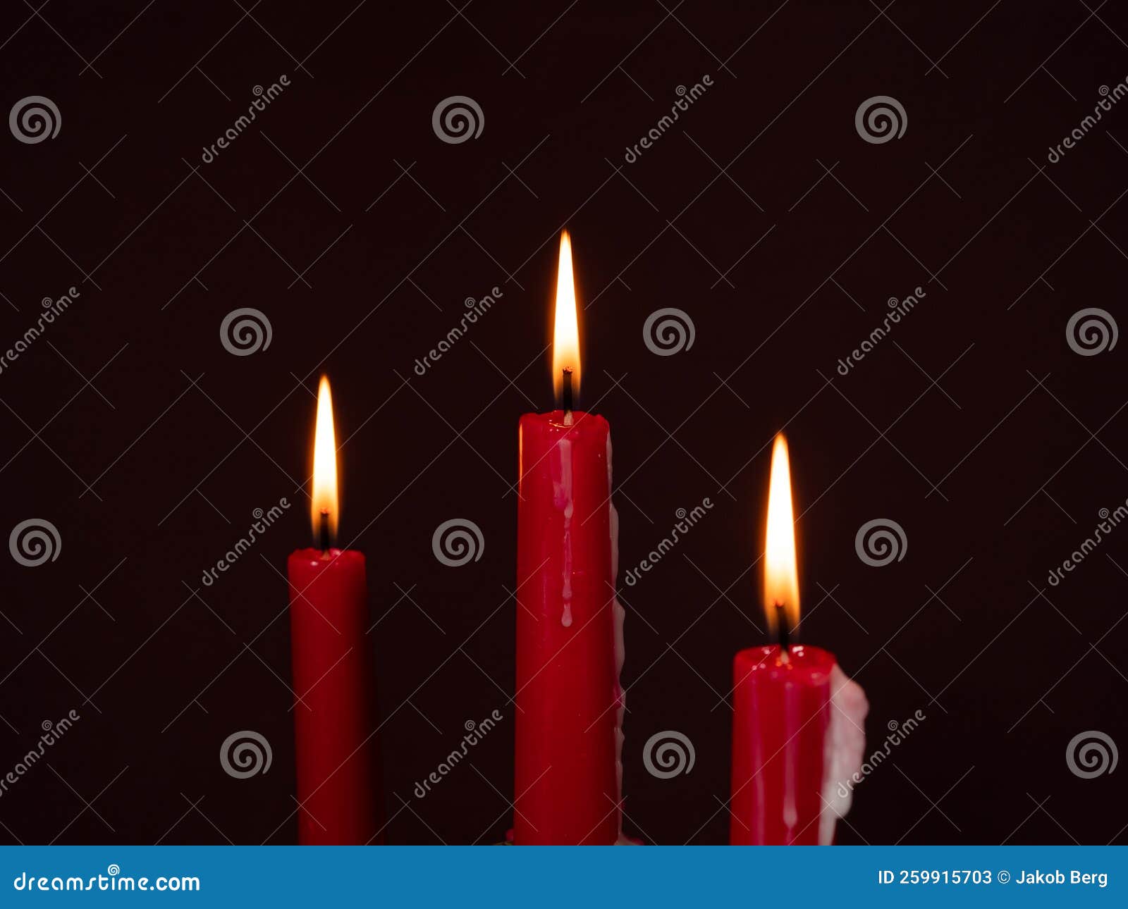 Burning Red Candles. Burning Candles on a Dark Background Stock Image