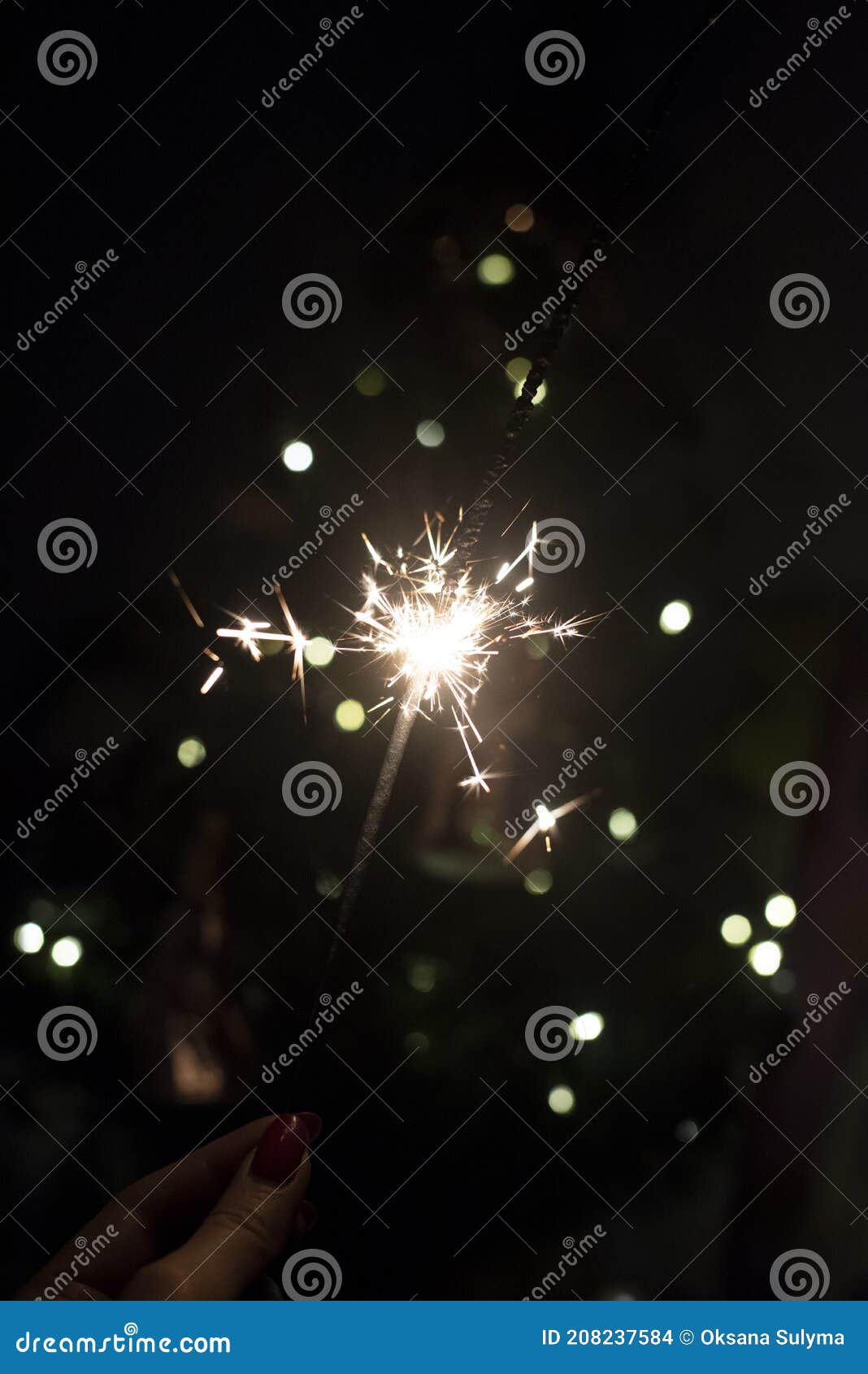 A Burning Sparkler on a Glitter Background Stock Photo Image of