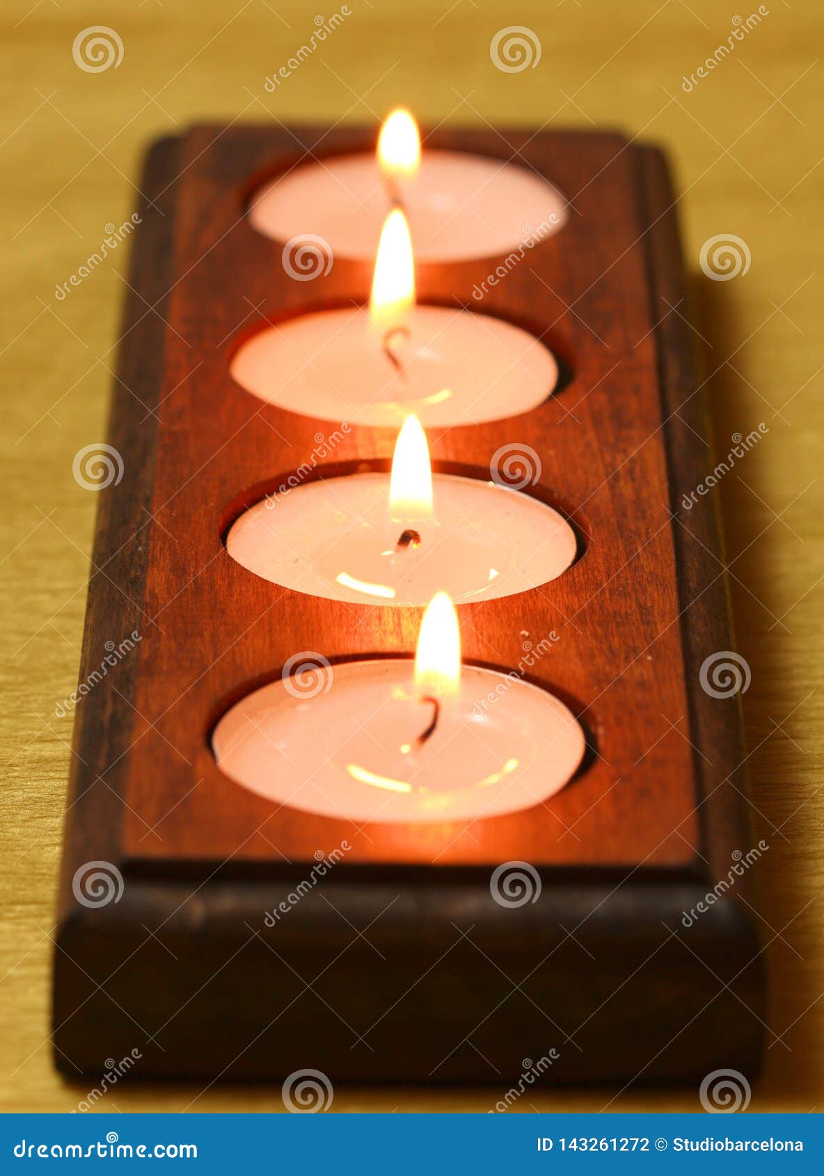 Burning Tea Light Candles in Wooden Holder Stock Photo Image of wood, tealight 143261272