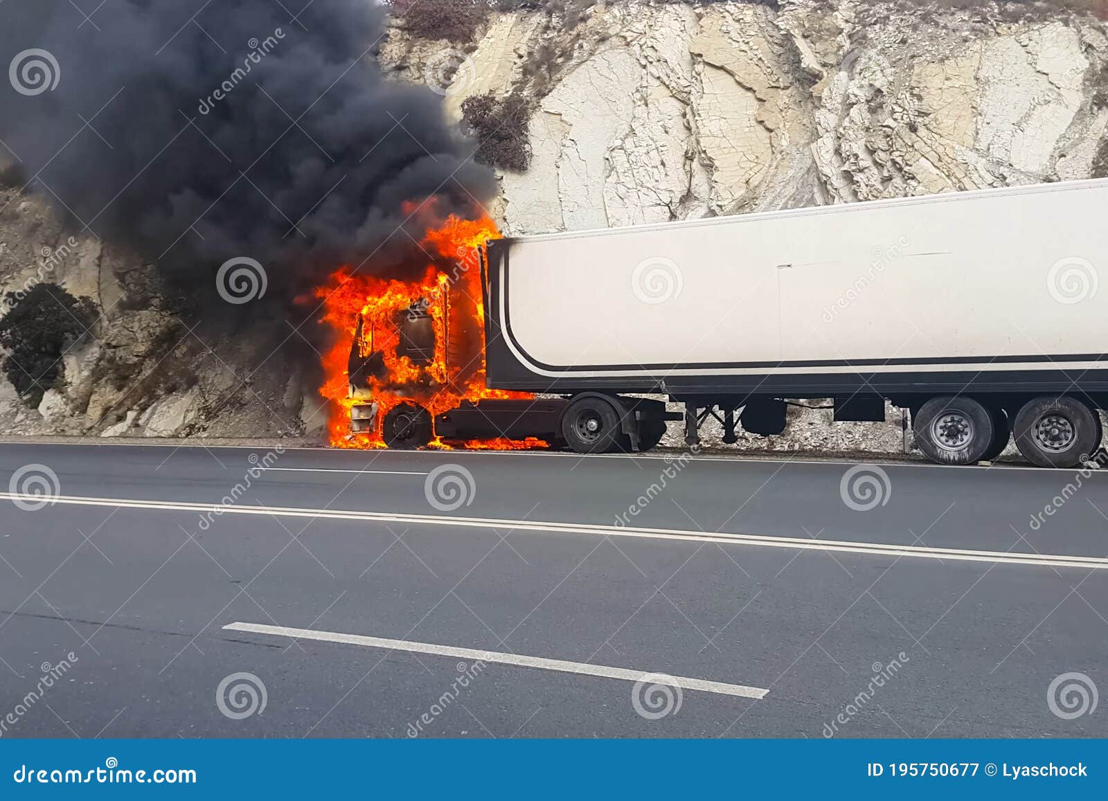 Burning Truck on the Road. Cab of the Truck is on Fire Stock Image