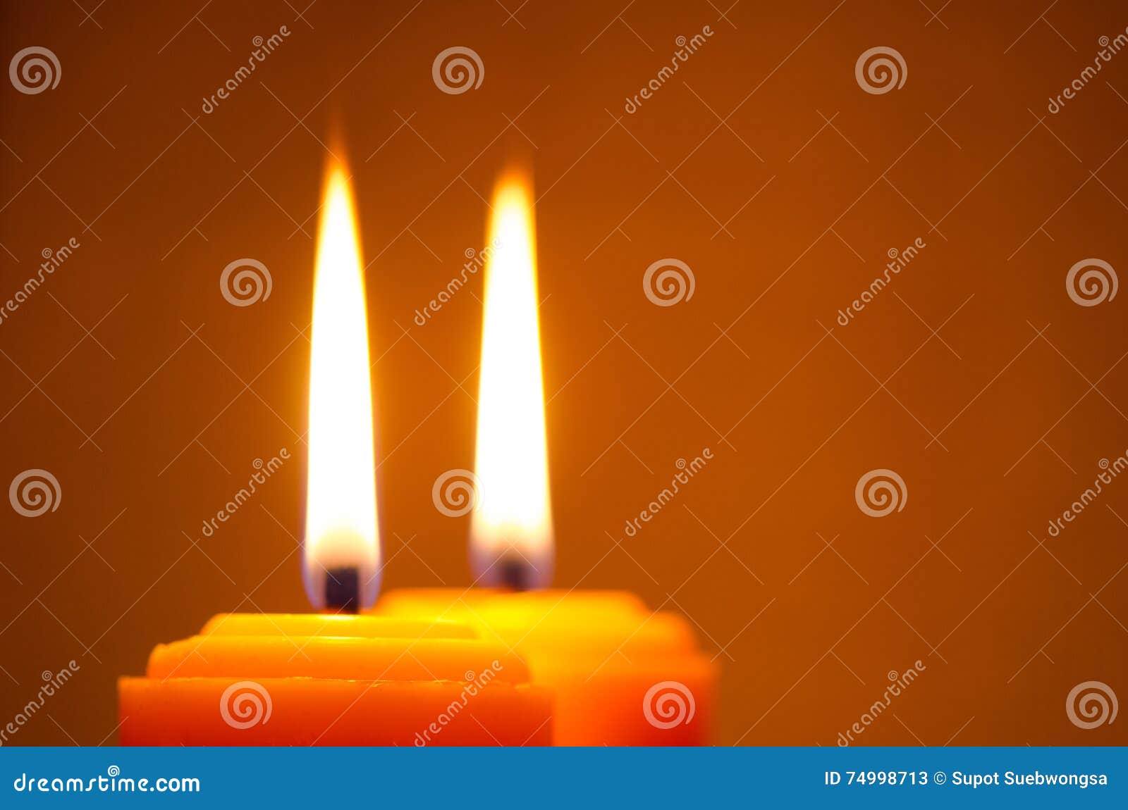 Burning yellow candles stock image. Image of medieval 74998713