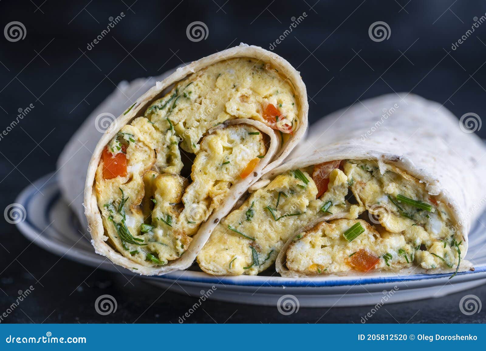 Burrito Wraps with Egg Omelet and Vegetables in Pita Bread Stock Photo