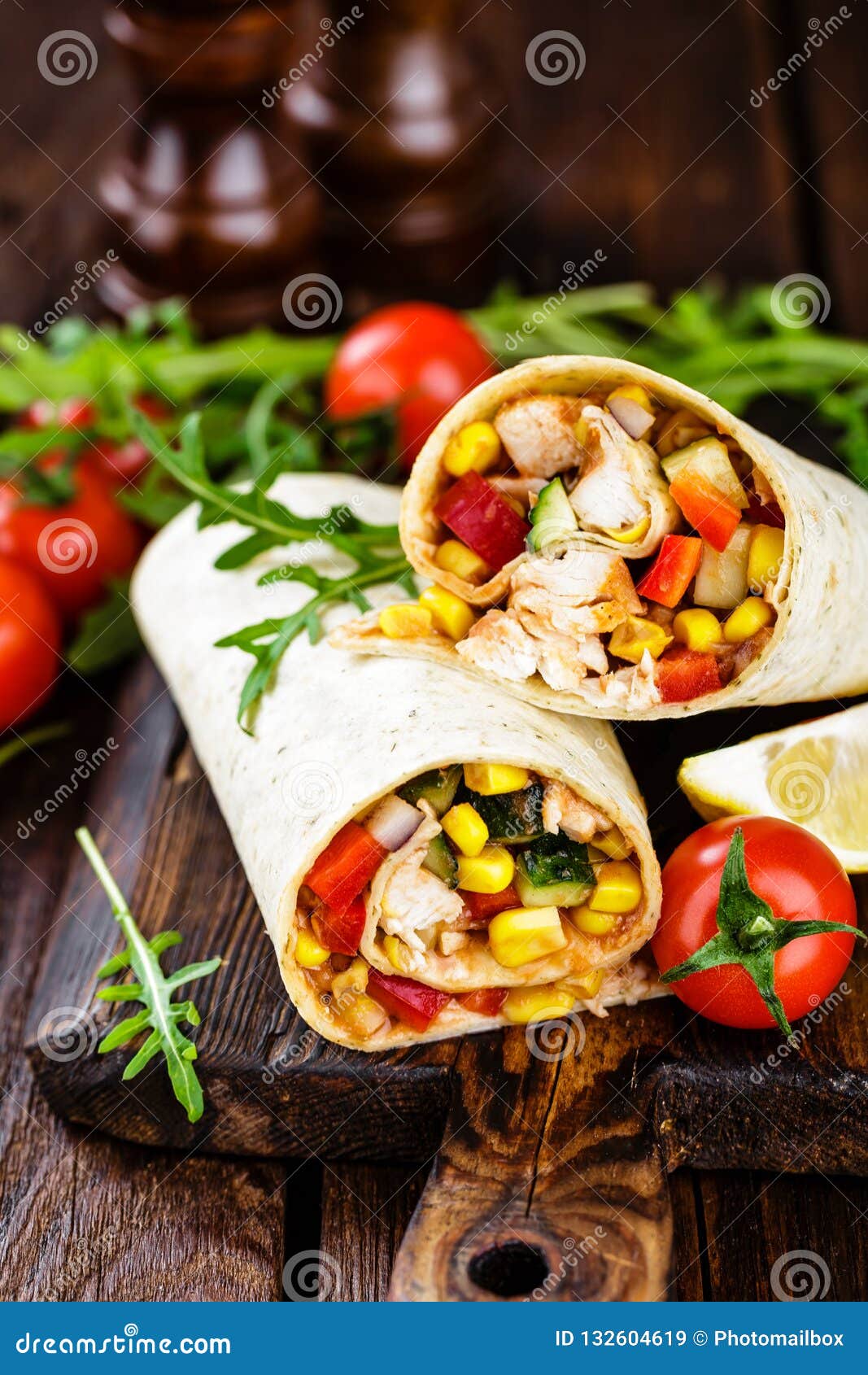 Burritos Wraps with Chicken Meat and Vegetables on Wooden Background