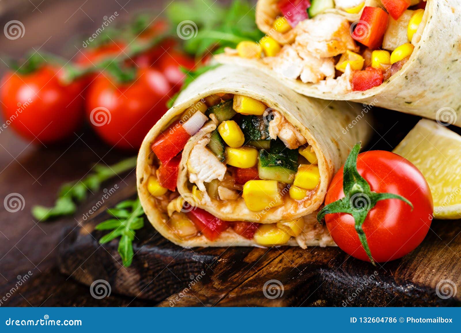 Burritos Wraps with Chicken Meat and Vegetables on Wooden Background