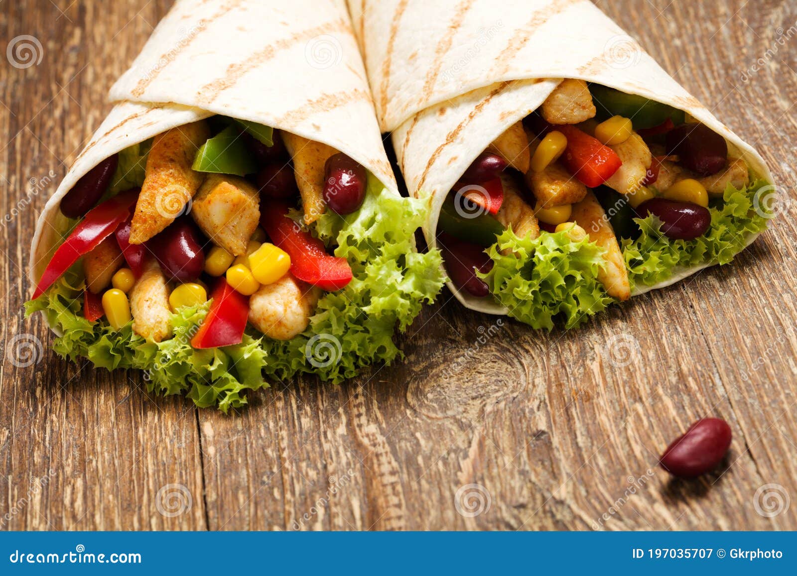 Burritos Wraps with Chicken. Wooden Background. Stock Image - Image of