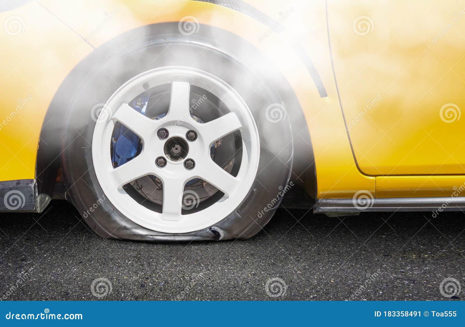 Burst car tire on road stock image. Image of pressure 183358491