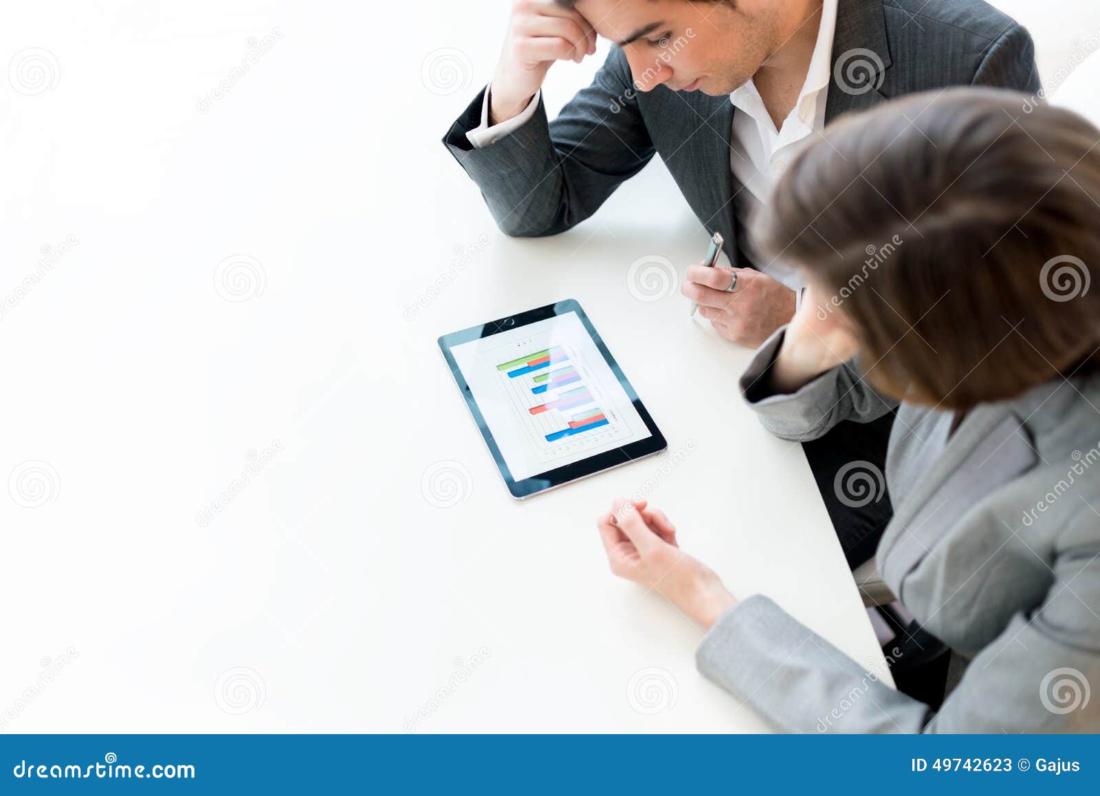 business colleagues analysing a graph