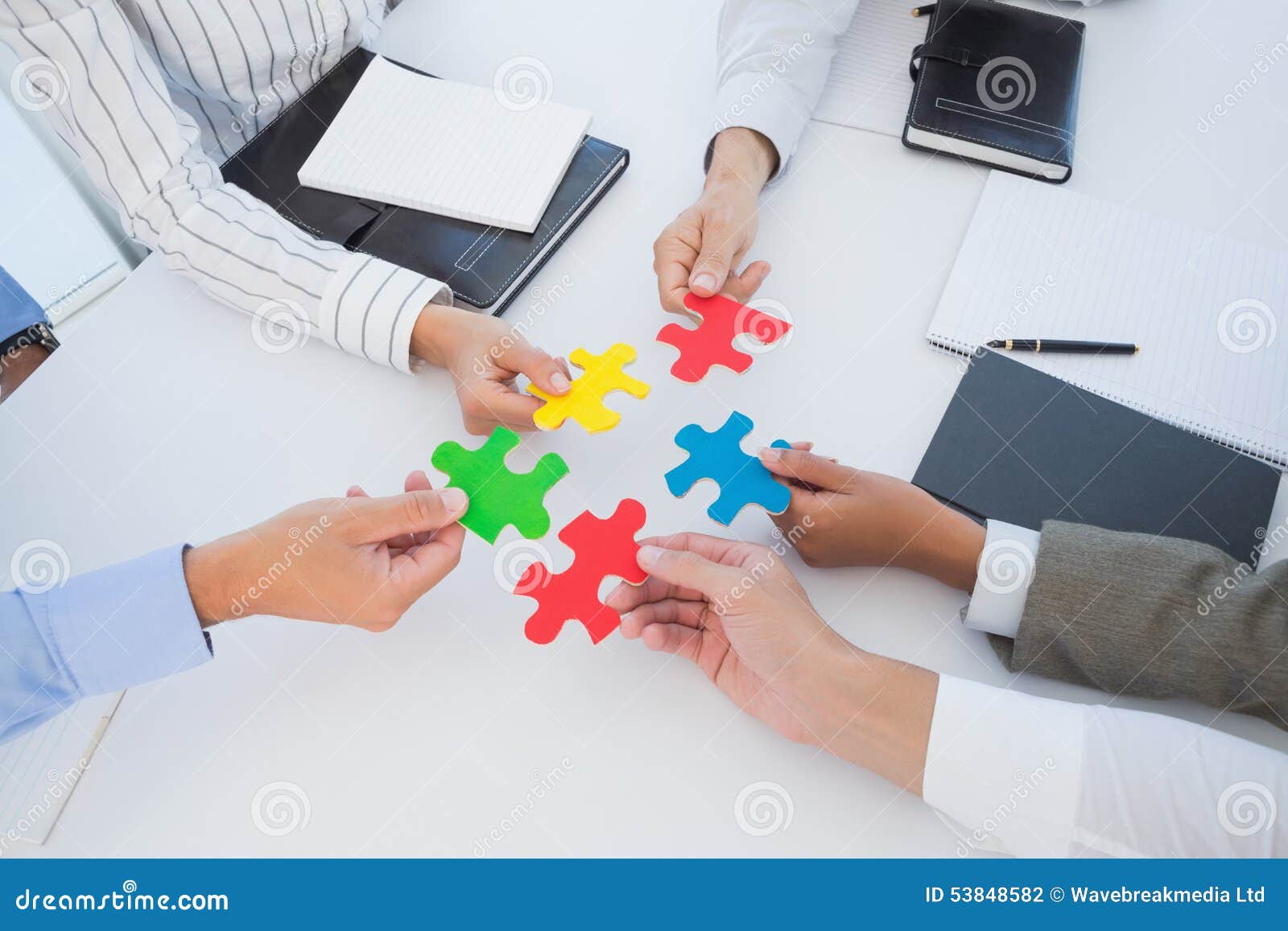Business Colleagues Holding Piece of Puzzle Stock Photo Image of
