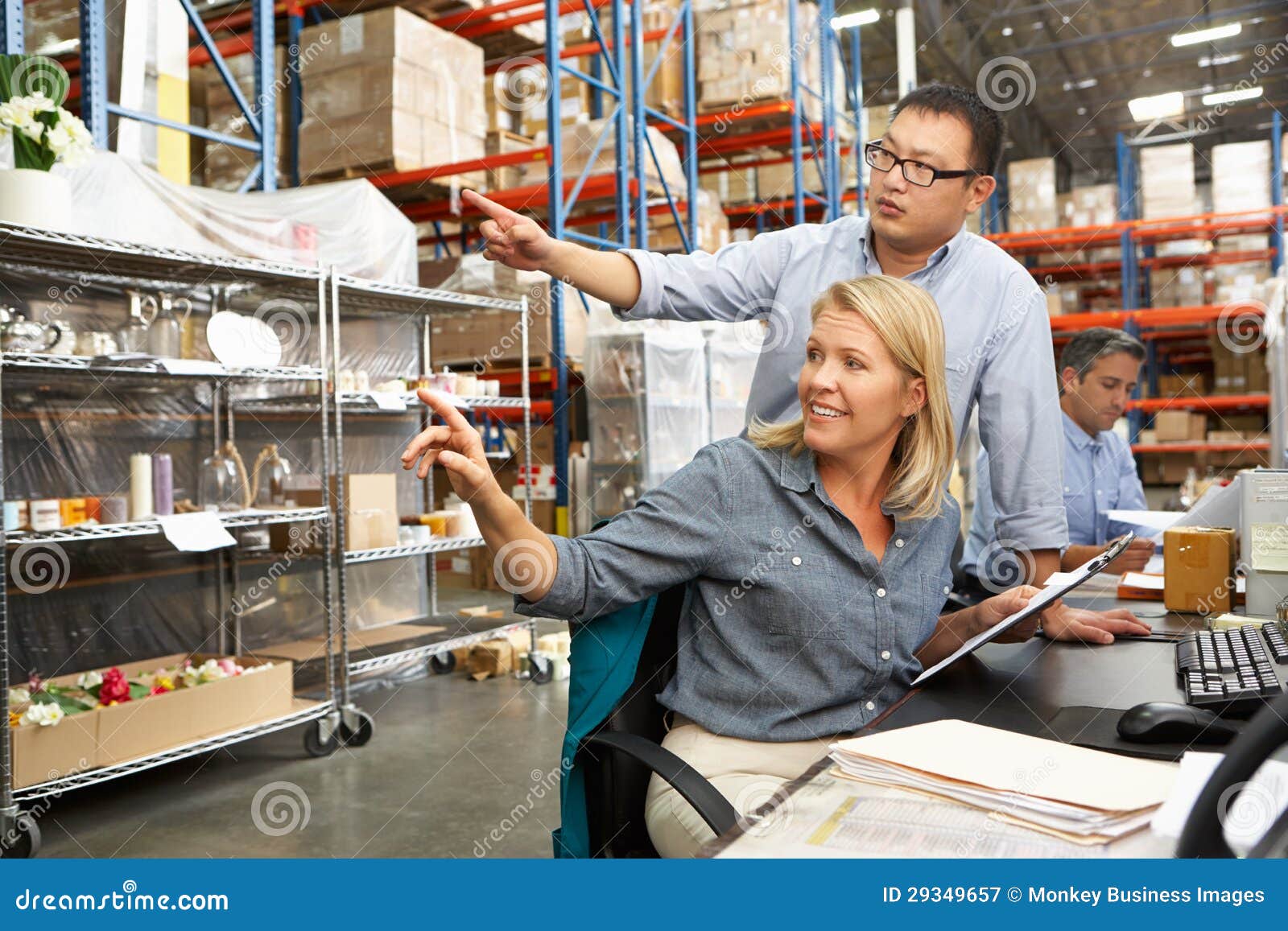 Business Colleagues Working at Desk in Warehouse Stock Image Image of business, people 29349657