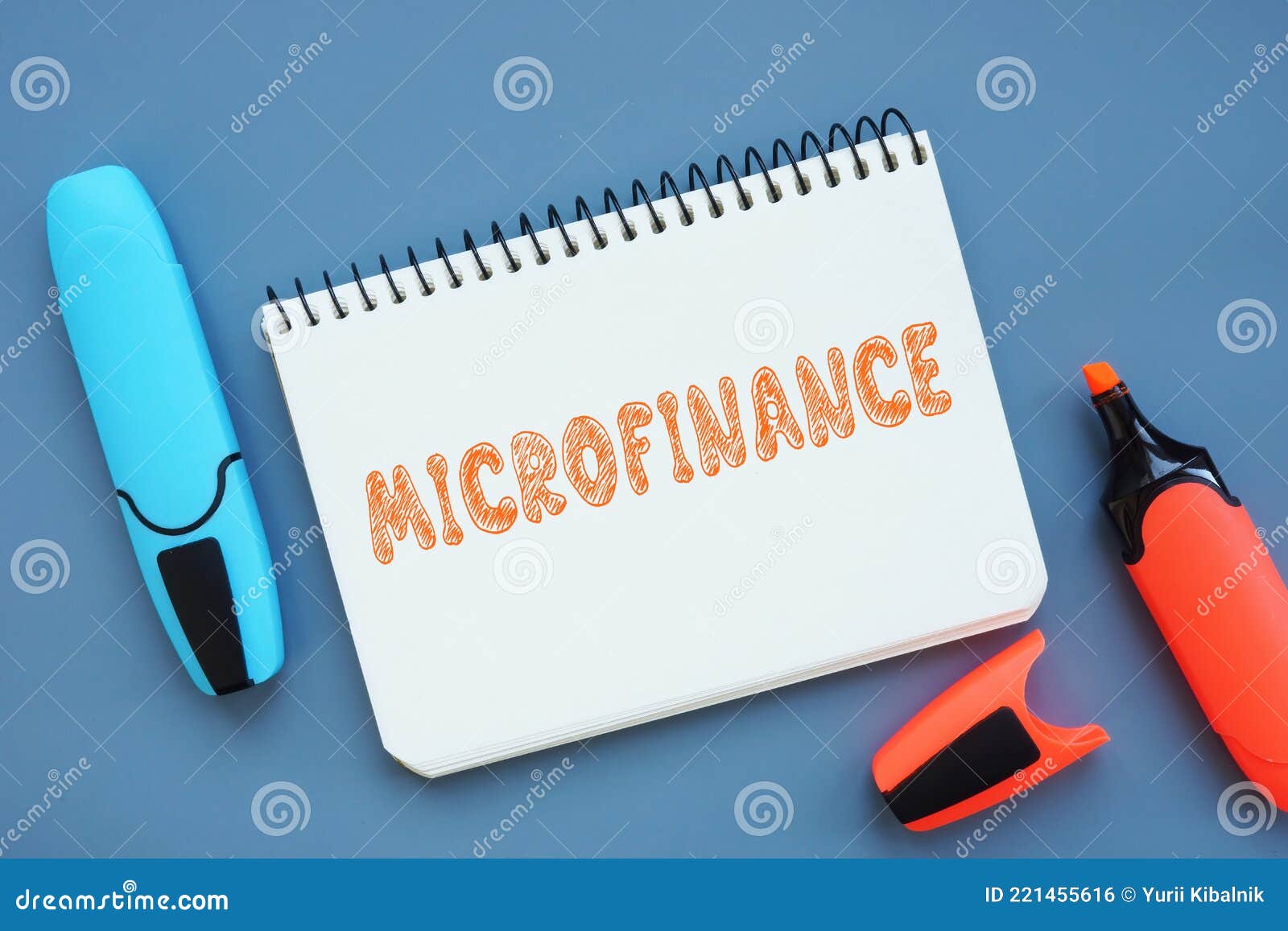 Business Concept Meaning MICROFINANCE with Phrase on the Sheet Stock